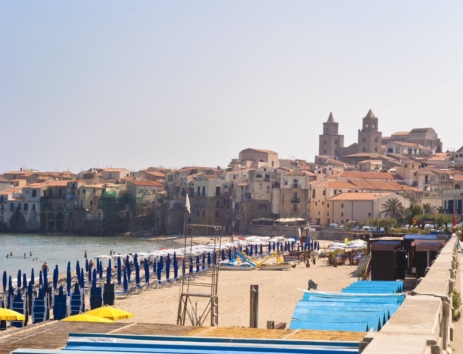 beach of Cefalu with centre city in the background. Sicily