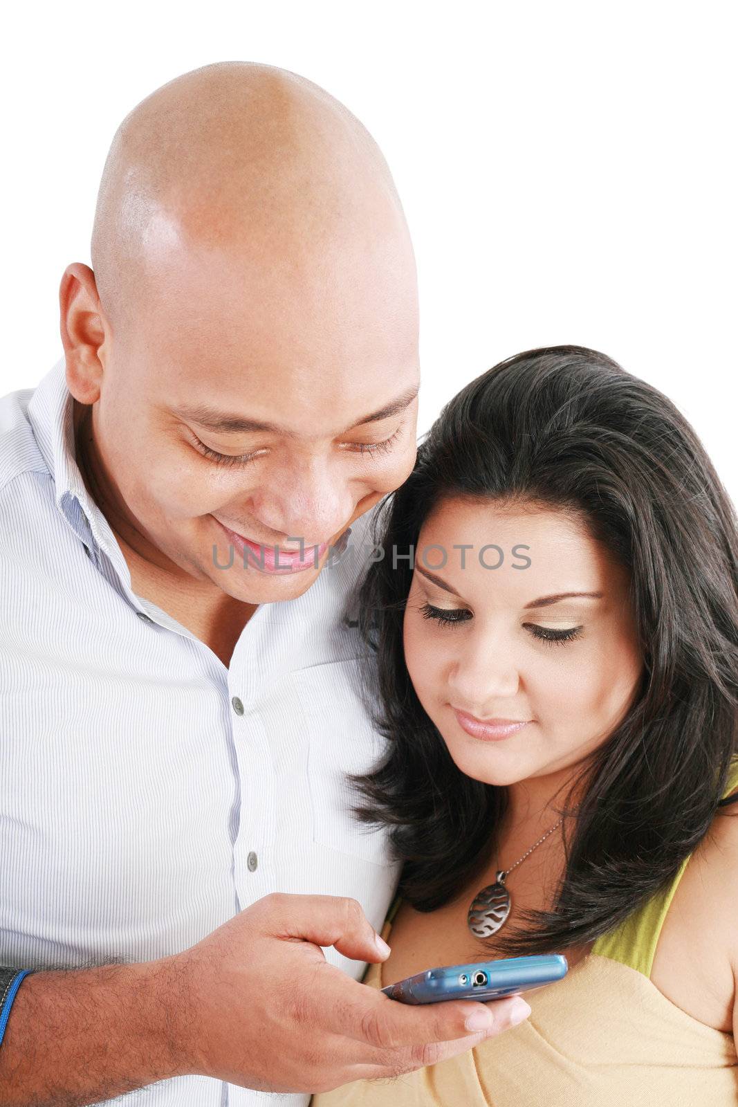 Portrait of a young couple sending a text message