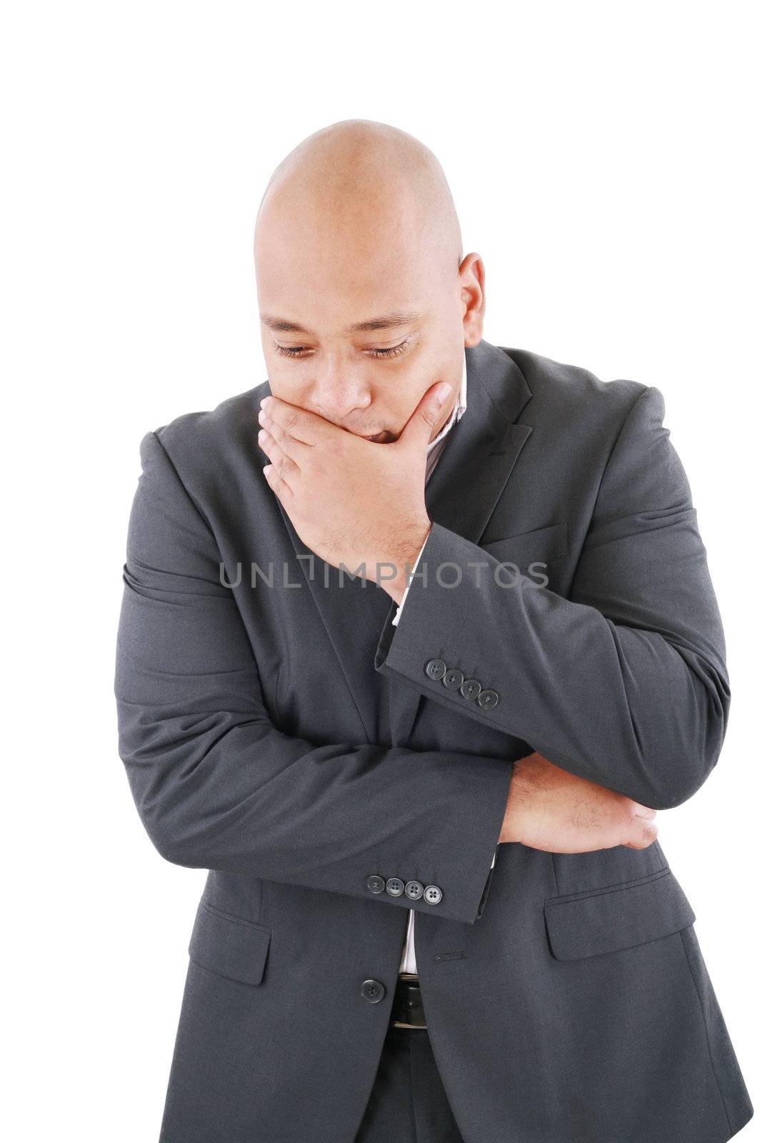 Portrait of a pensive worried businessman in studio on isolated white background
