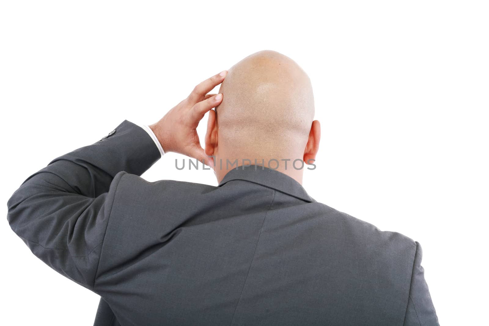 Handsome young business man in modern elegant suit standing back by dacasdo