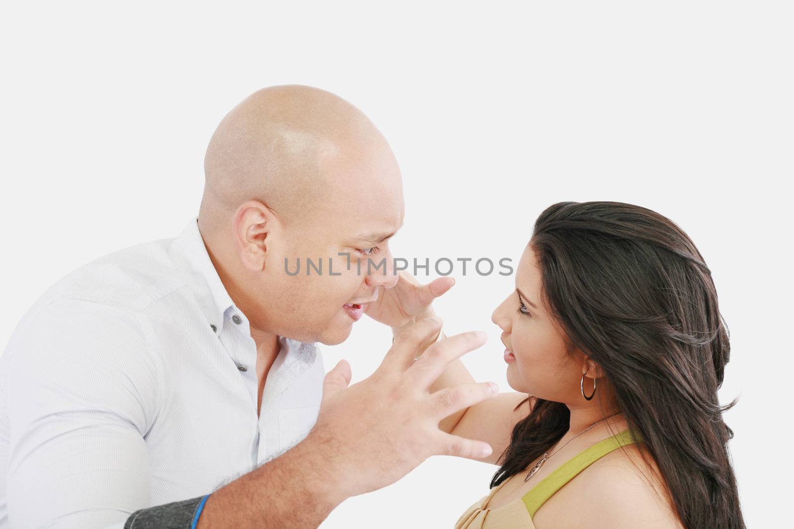 Studio shot of a young couple fighting by dacasdo