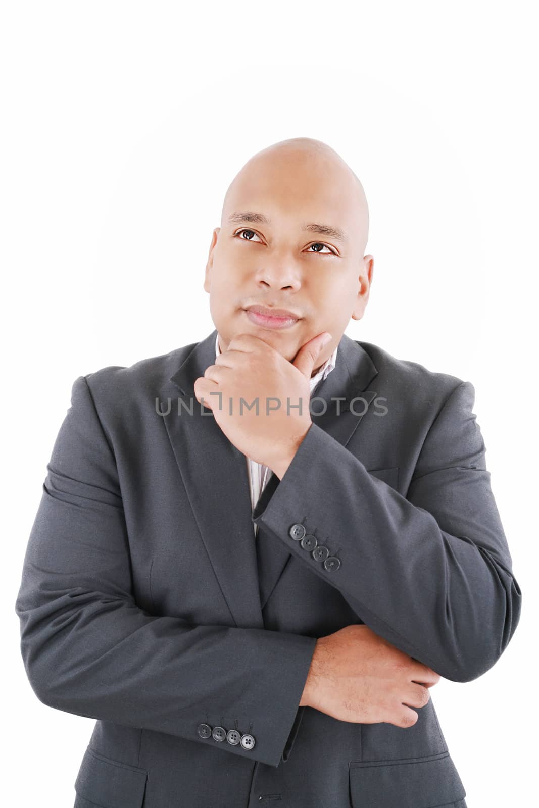 Portrait of handsome young thoughtful businessman isolated over by dacasdo