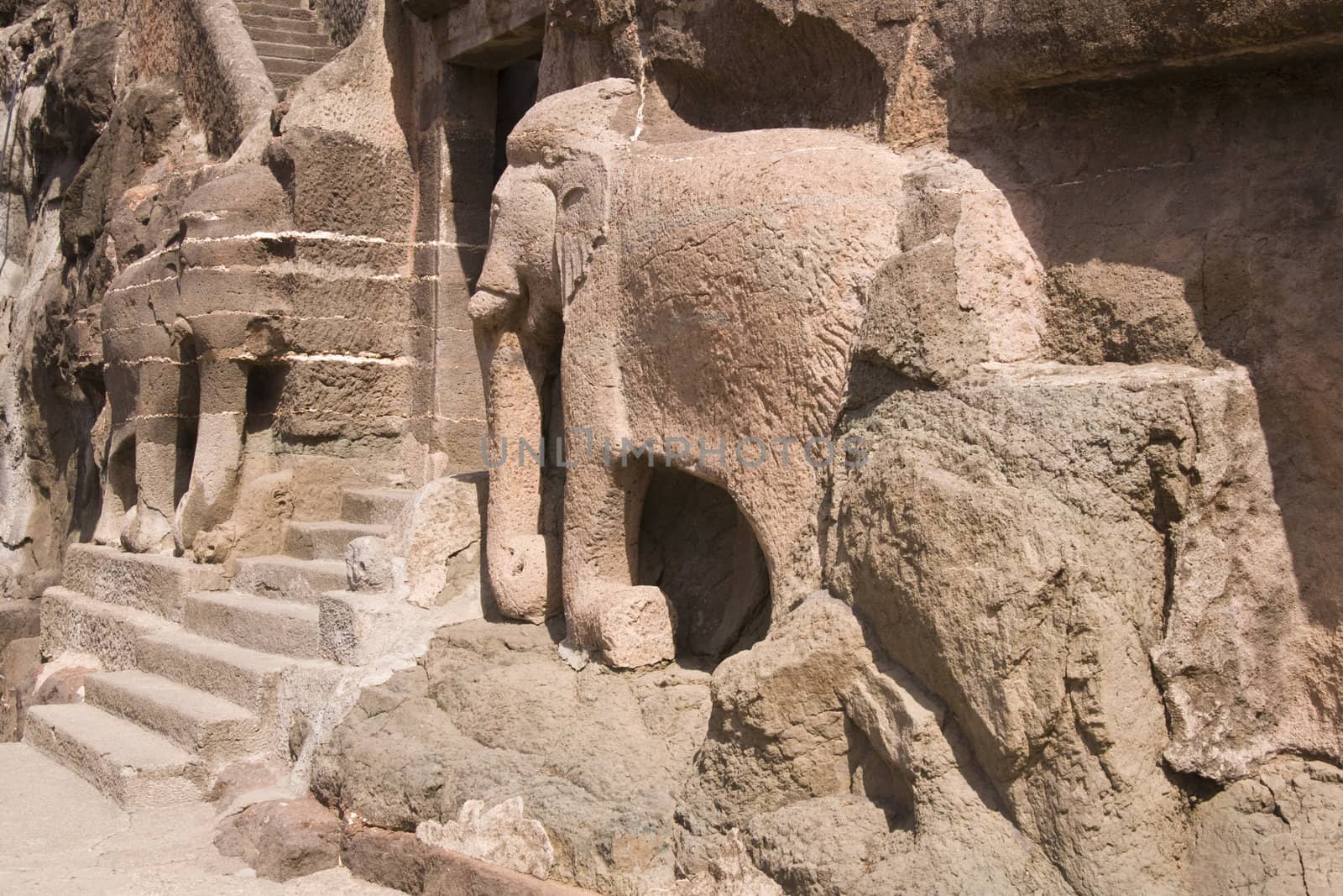 Elephant statues in the cliff marking the entrance to the ancient Buddhist cave temples at Ajanta, near Aurangabad, India. 2nd Century BC to 6th Century AD