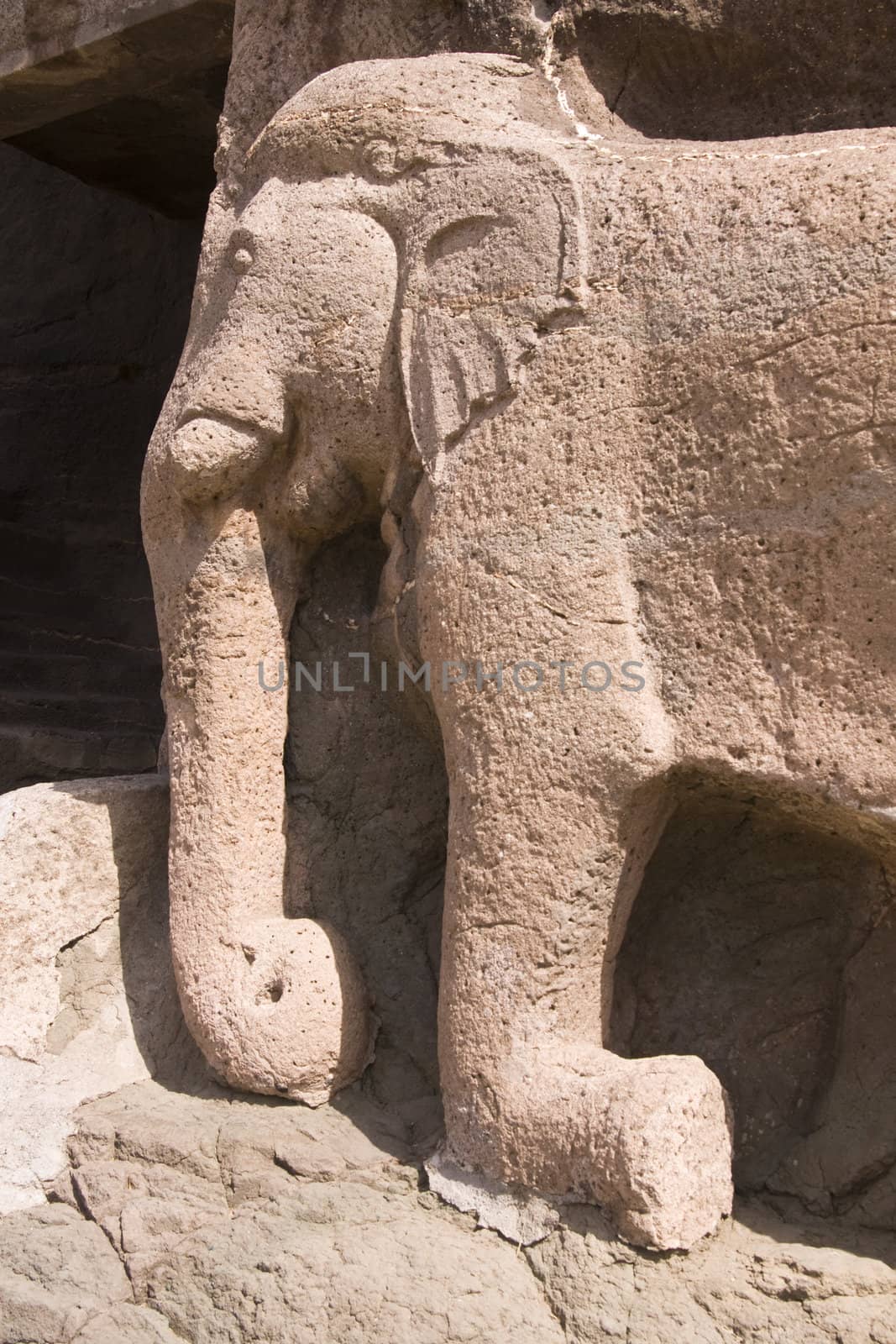 Elephant statue in the cliff marking the entrance to the ancient Buddhist cave temples at Ajanta, near Aurangabad, India. 2nd Century BC to 6th Century AD