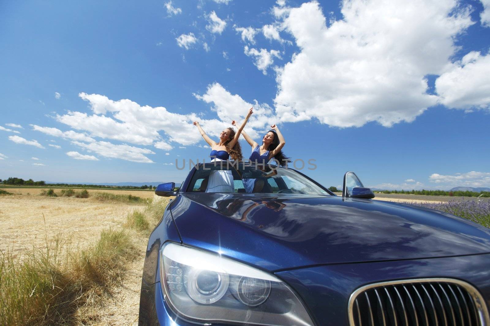 women dance in car