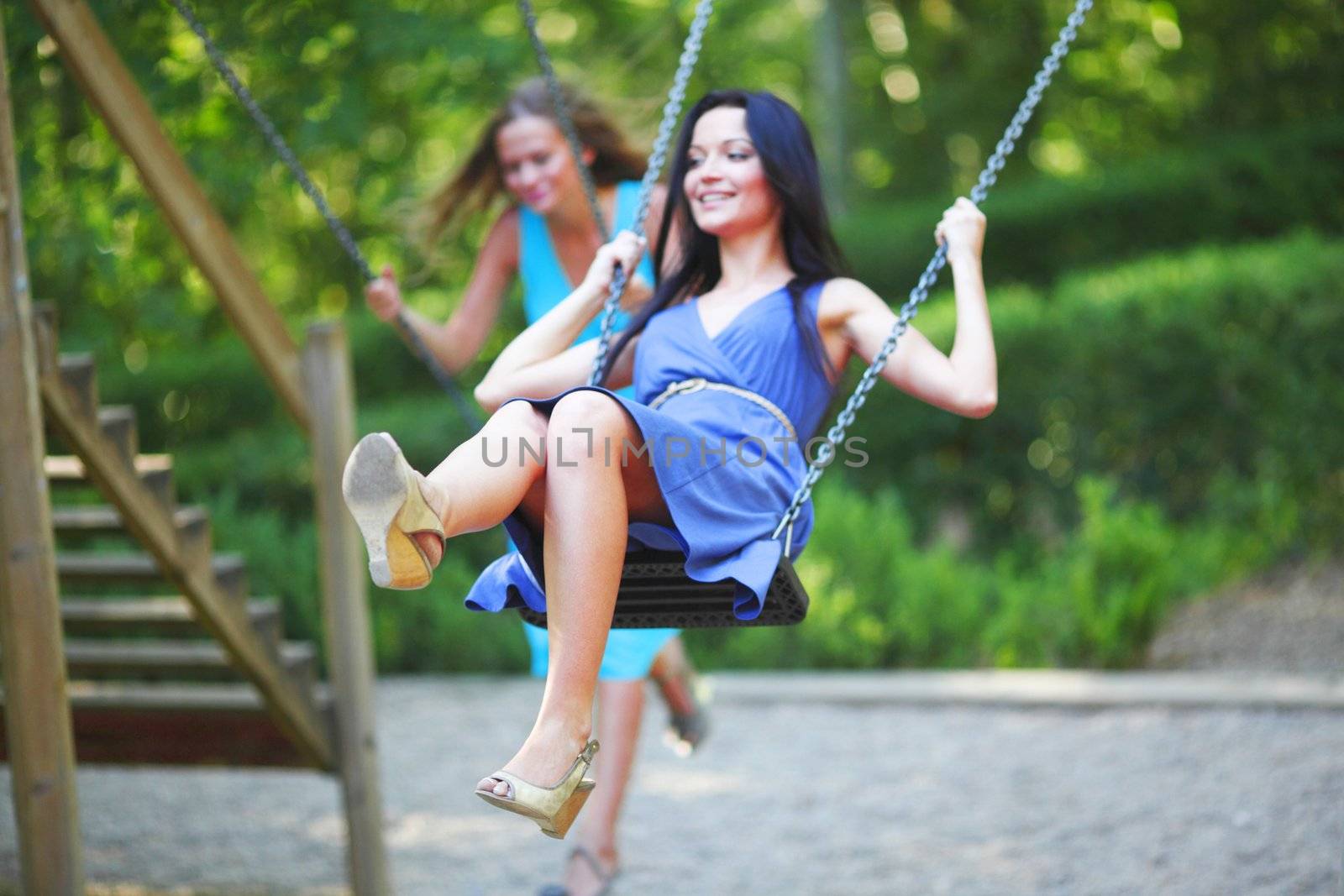 young women swinging
