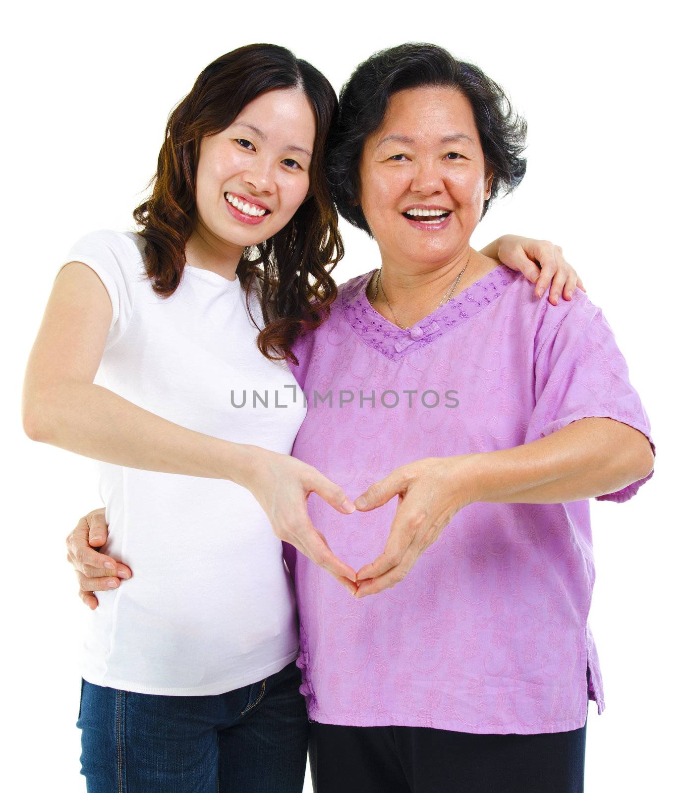 Asian senior and adult daughter hands forming a love symbol
