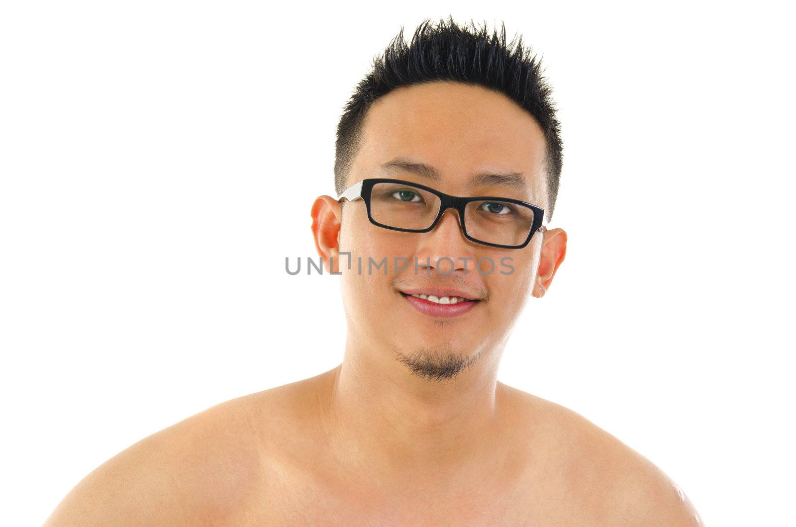 Pan Asian male portrait on plain background