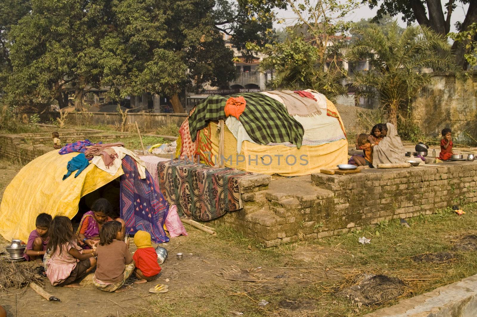 Poor Indian families living in makeshift shacks by the side of the road in Bihar, India.