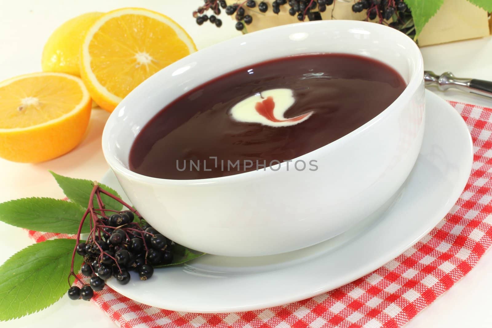 a bowl with Elderberry soup of fresh elderberries