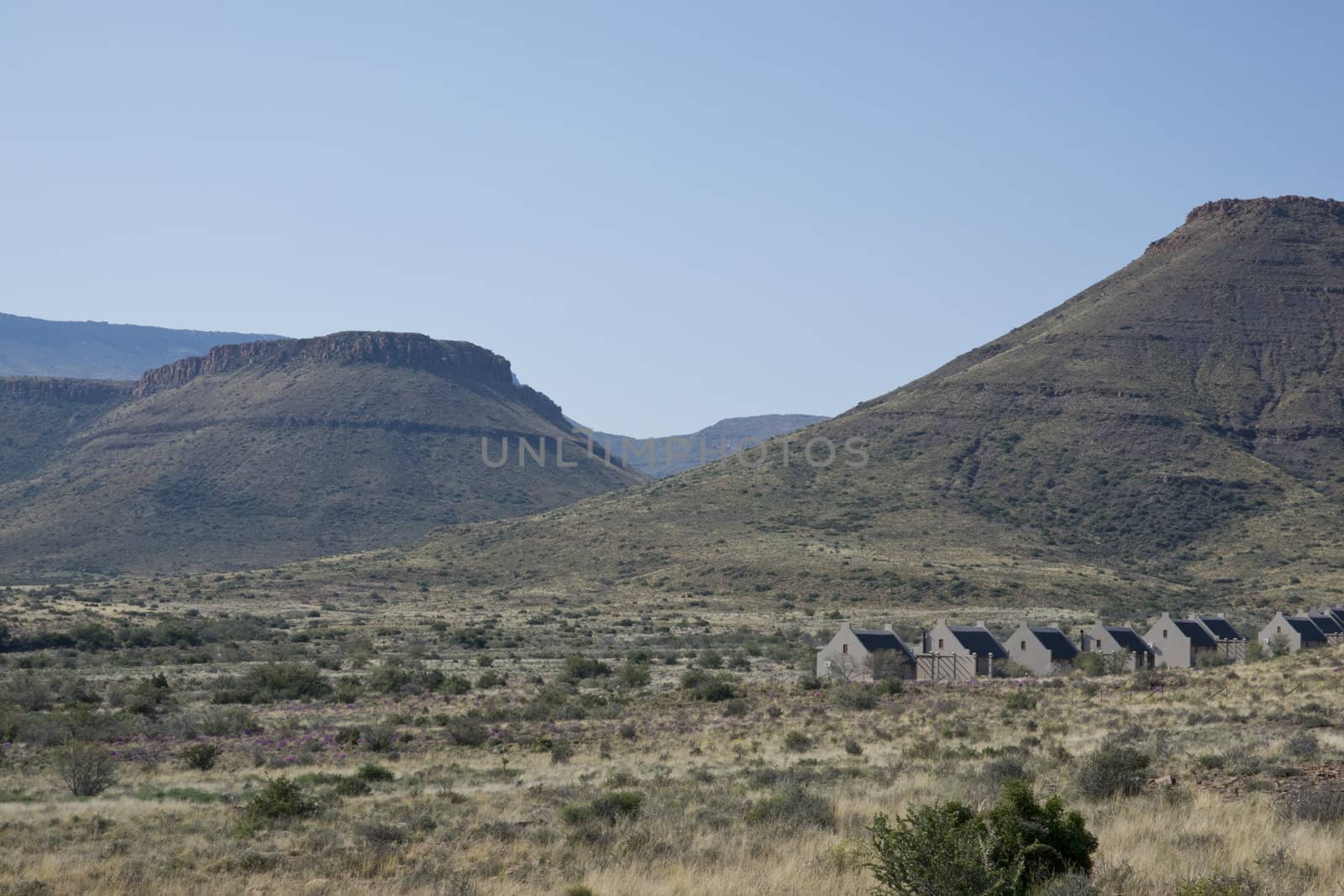 Karoo National Park in the Western Cape of South Africa. Arid landscape with flat topped hills. Visitor accommodation.