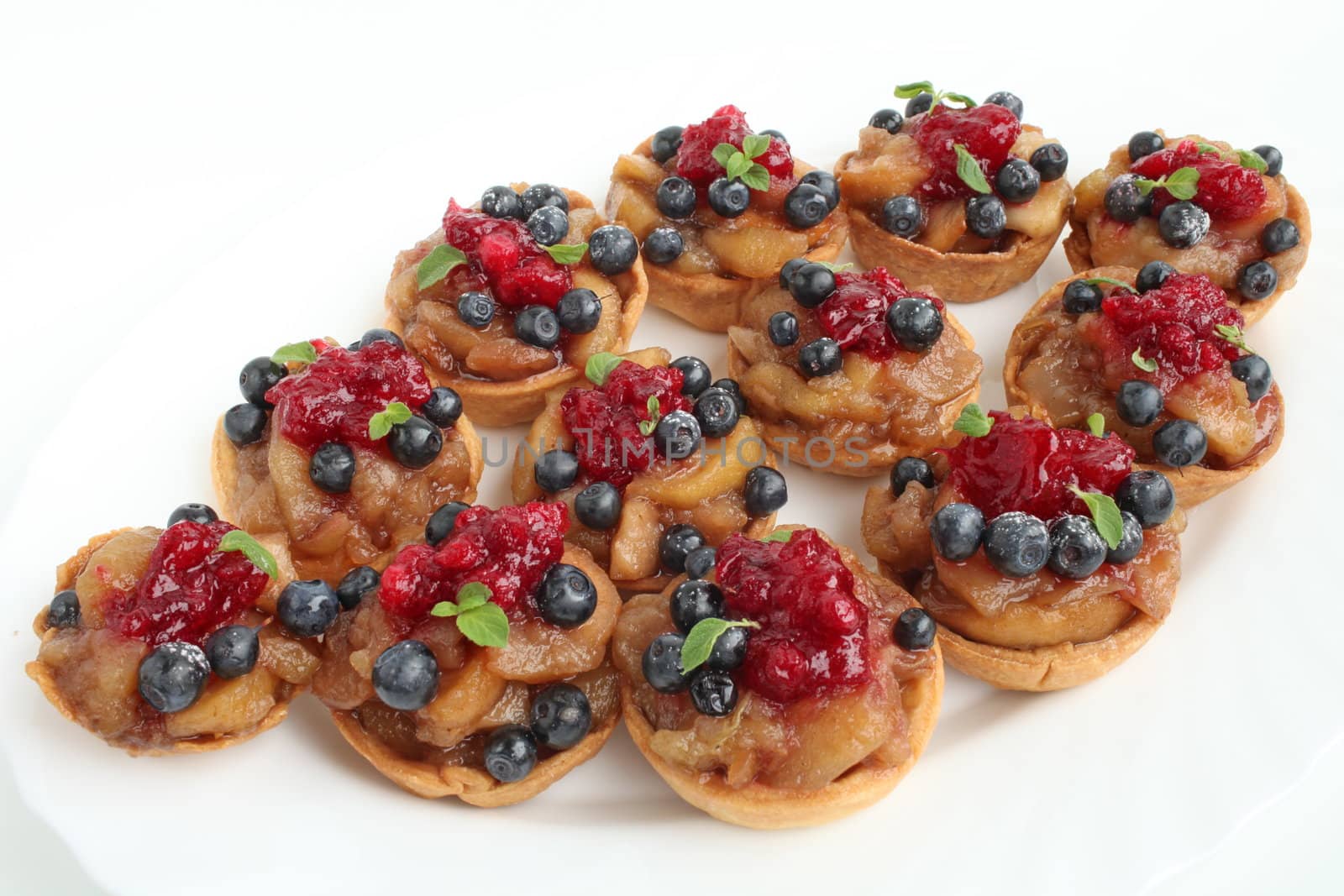 Sweet dessert with apples blueberries and cranberries
