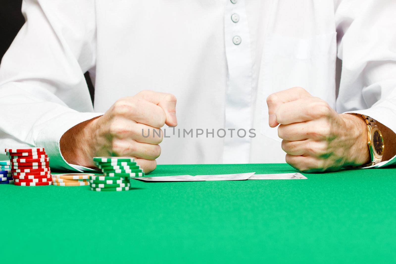 male player at the card table in the casino