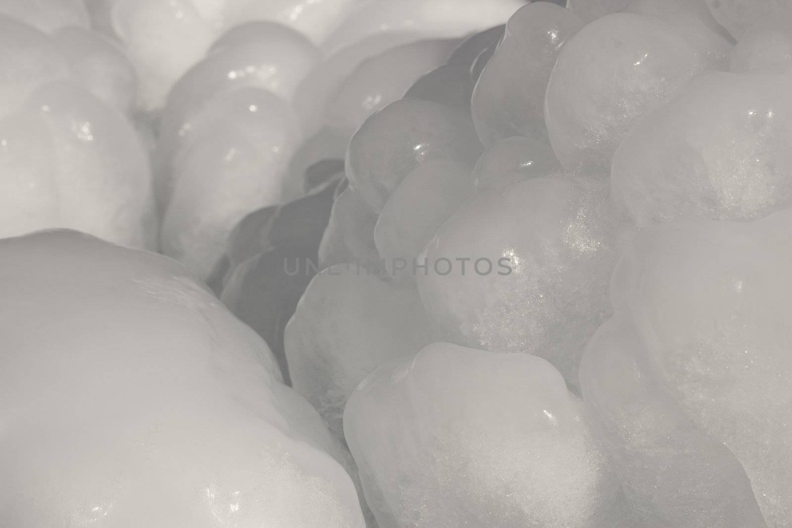 smooth round ice frozen in winter close-up