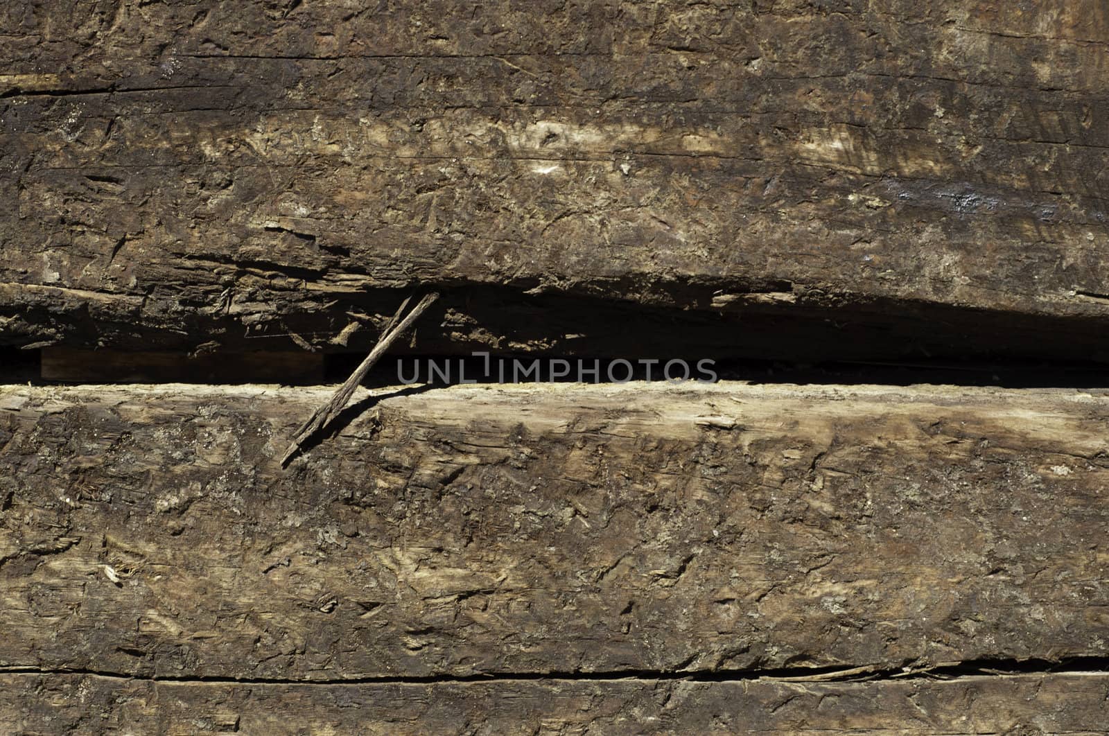 two railroad ties stacked texture or background with splintering