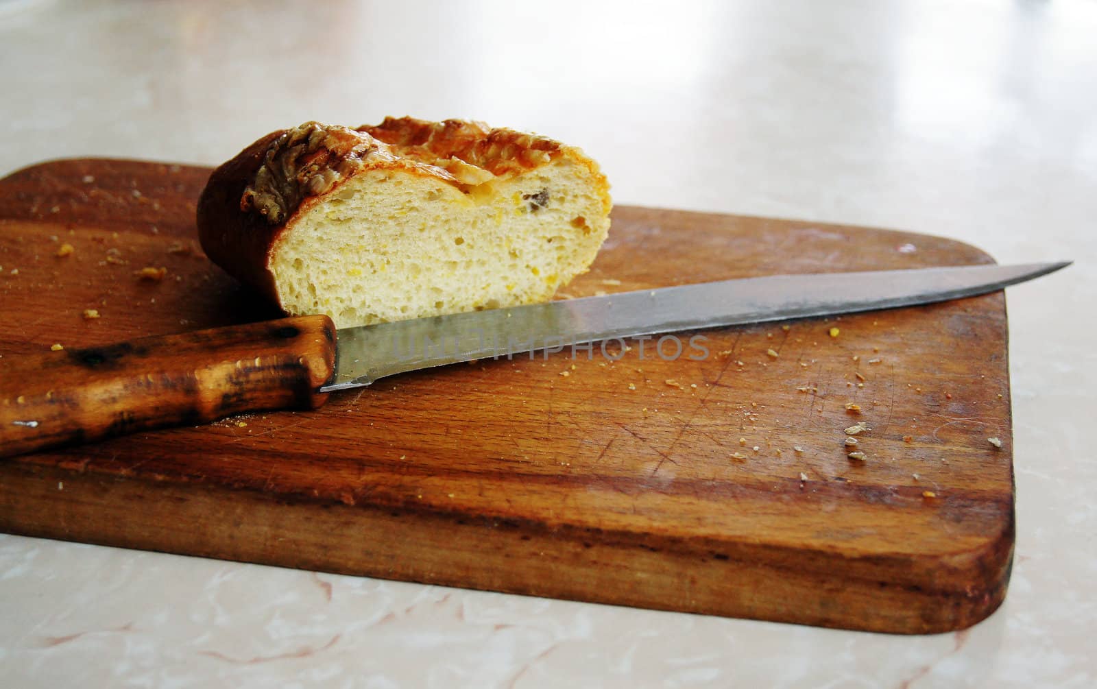 Bread and knife on the board