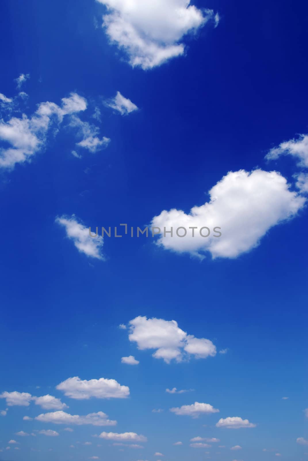 Blue sky with small clouds by fyletto