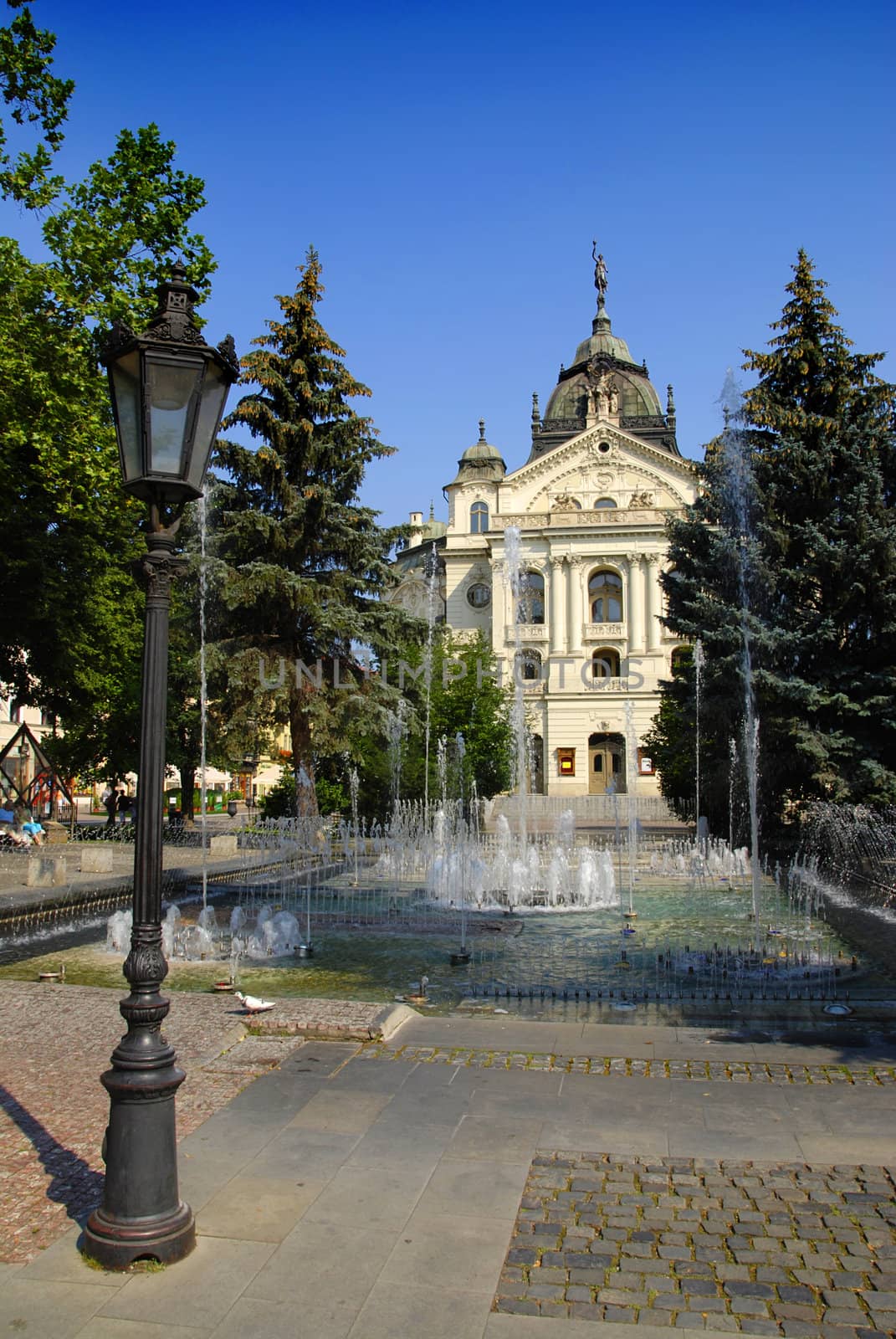 City Hall of slovakian city Kosice with fountains and lantern in front of it