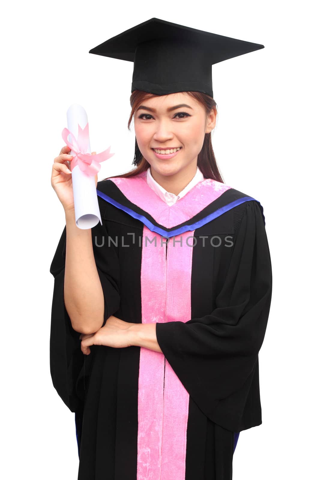 young woman with graduation cap and gown with arm raised holding diploma