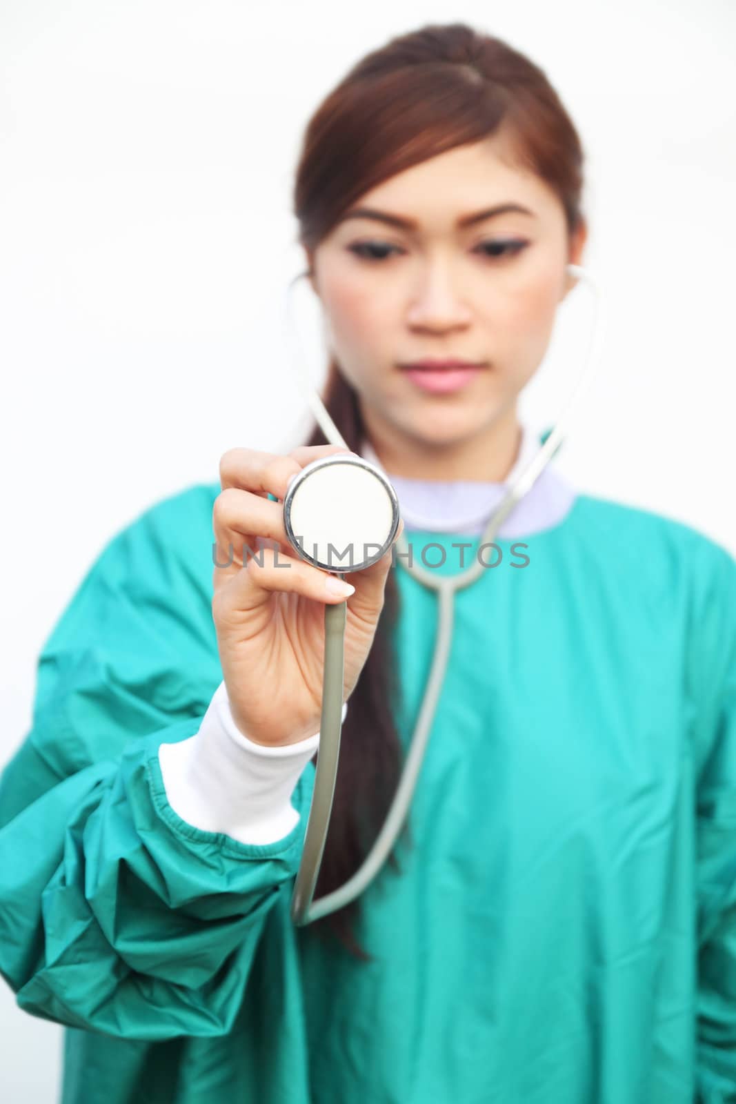 female doctor wearing a green scrubs and stethoscope by geargodz