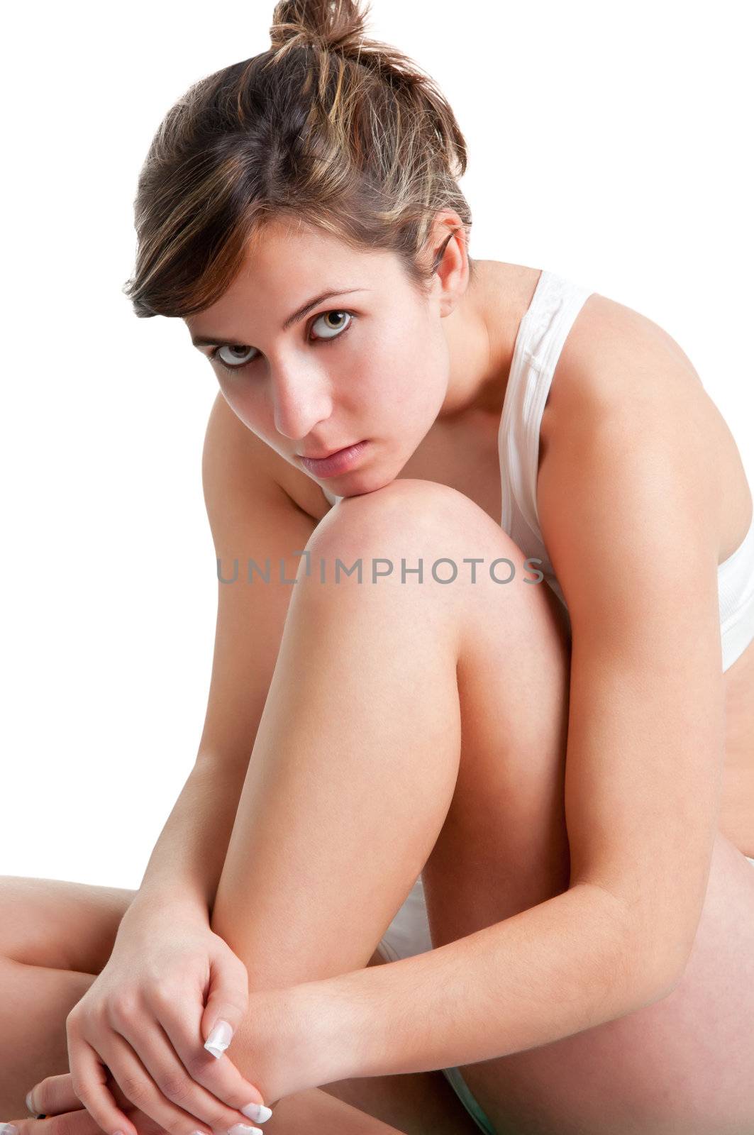 Woman sitting on the floor, resting, isolated in a white background