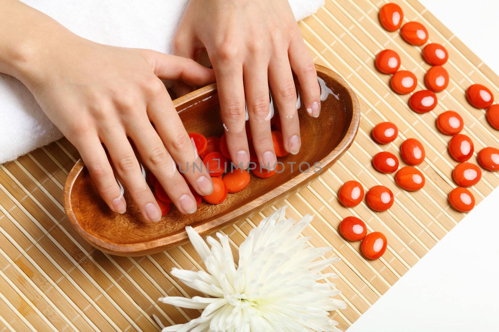 Young woman is getting manicure in a beauty salon
