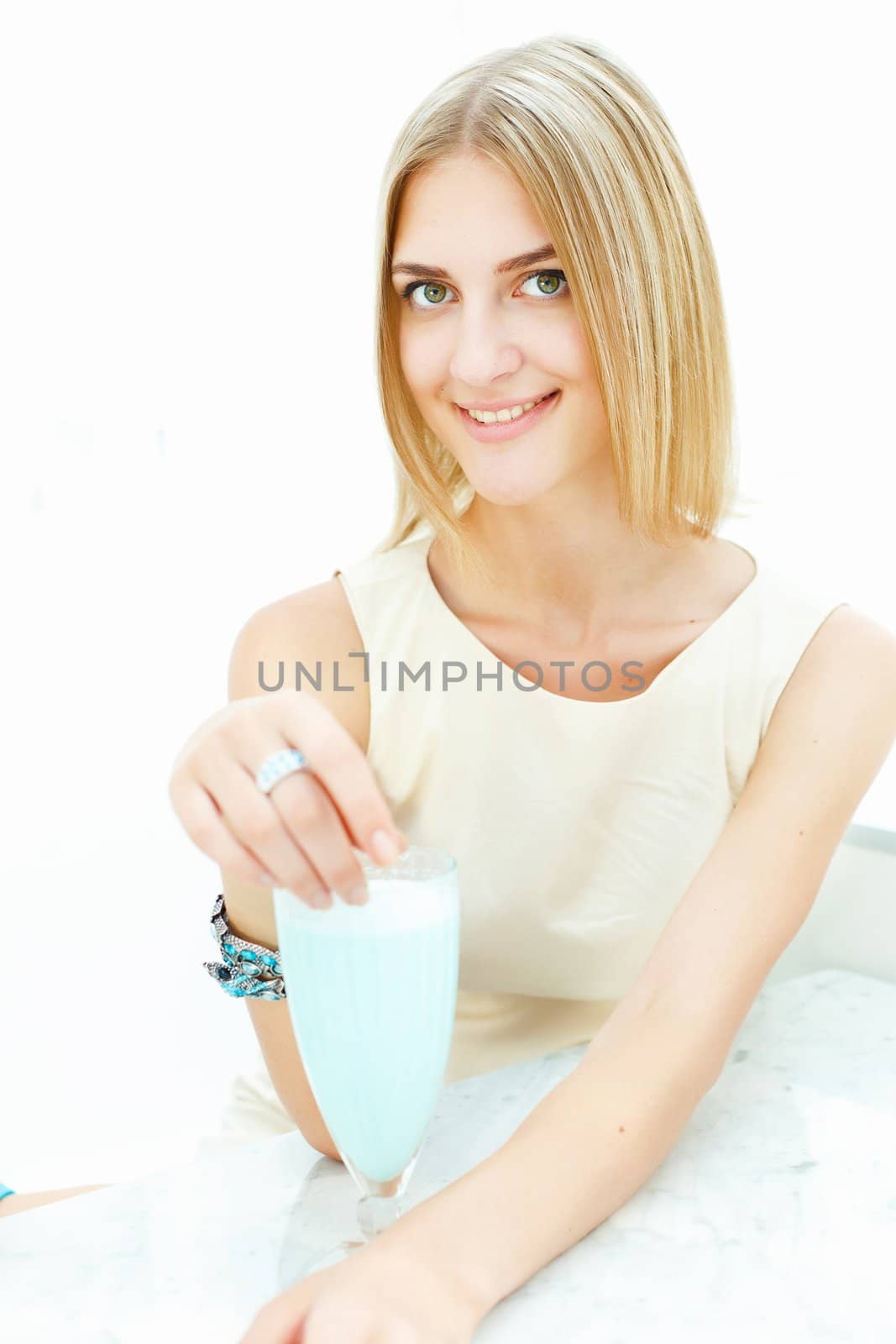 Young woman with a glass of drink by sergey_nivens