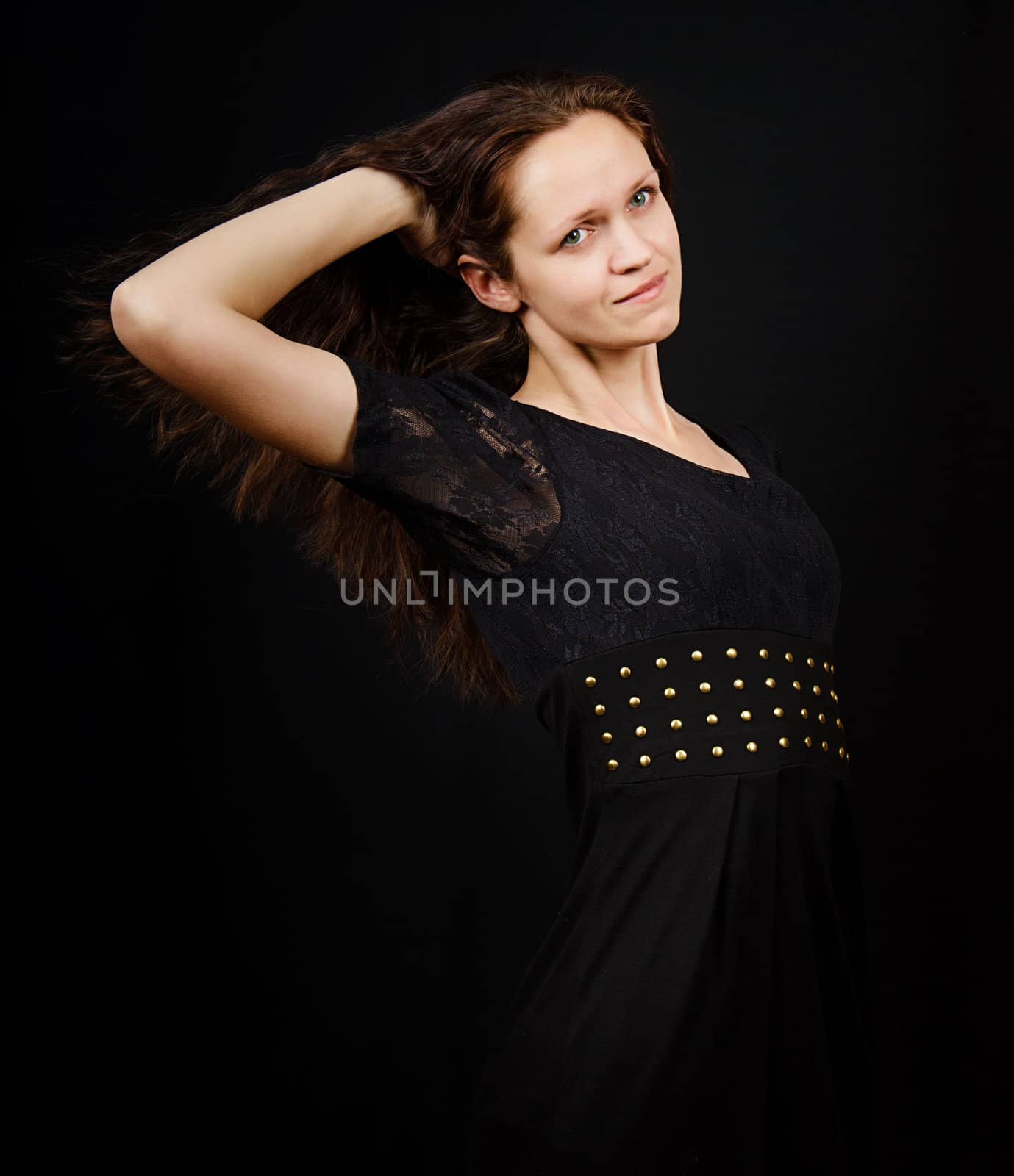 girl with flowing long hair on a black background