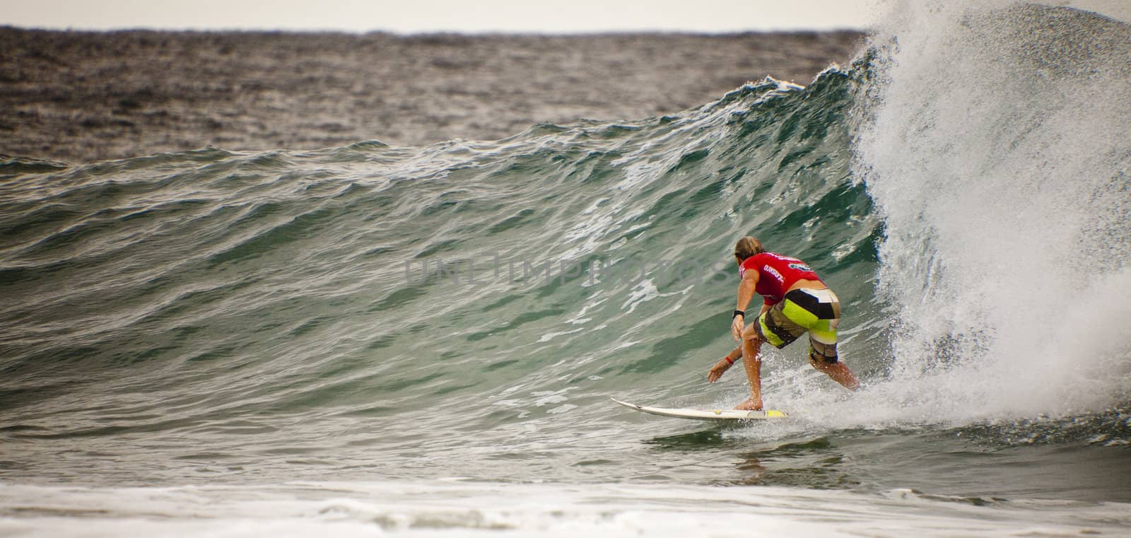 SNAPPER ROCKS, GOLD COAST, AUSTRALIA - 9 MARCH: Unidentified Surfer races the Quiksilver & Roxy Pro World Title Event. 9 March 2013, Snapper Rocks, Gold Coast, Australia