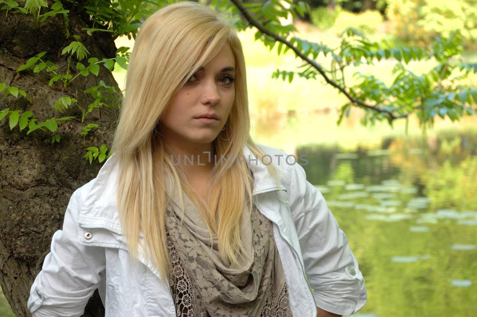 Young female model wears casual clothes. Sits with natural face expression, teenage girl cool and relaxed. 