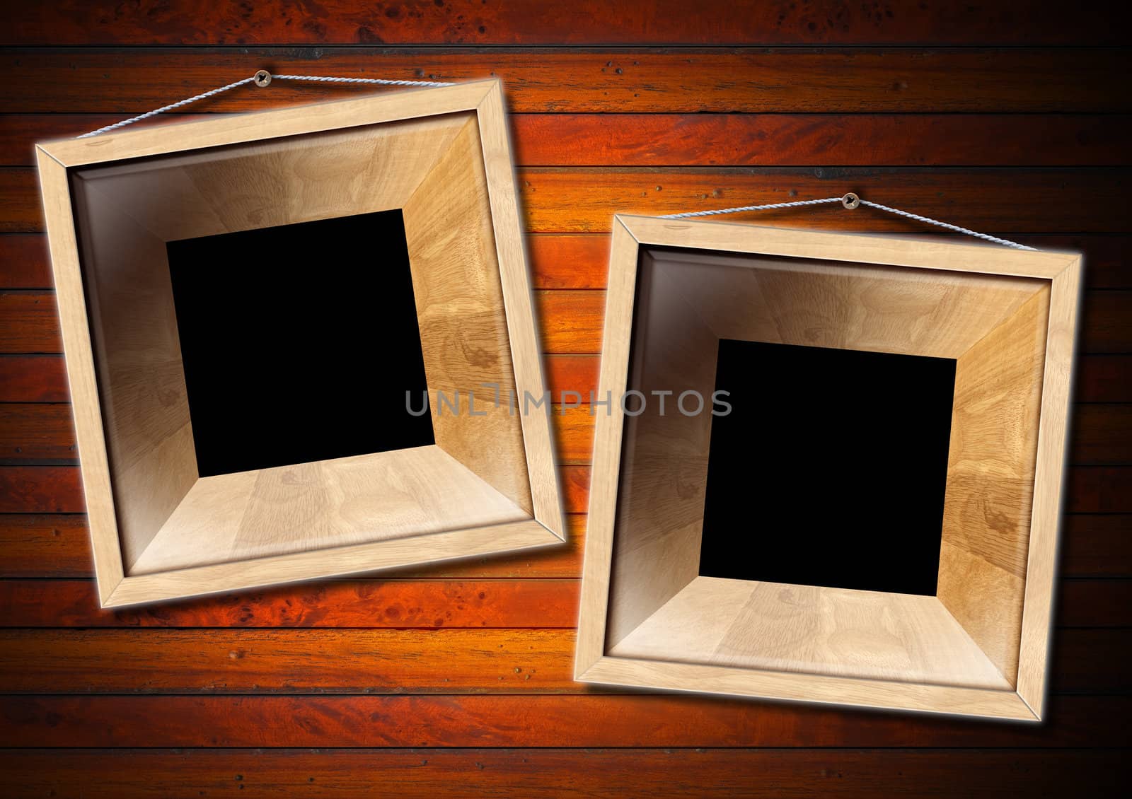 Two empty frames of light wood on a old dark wooden wall


