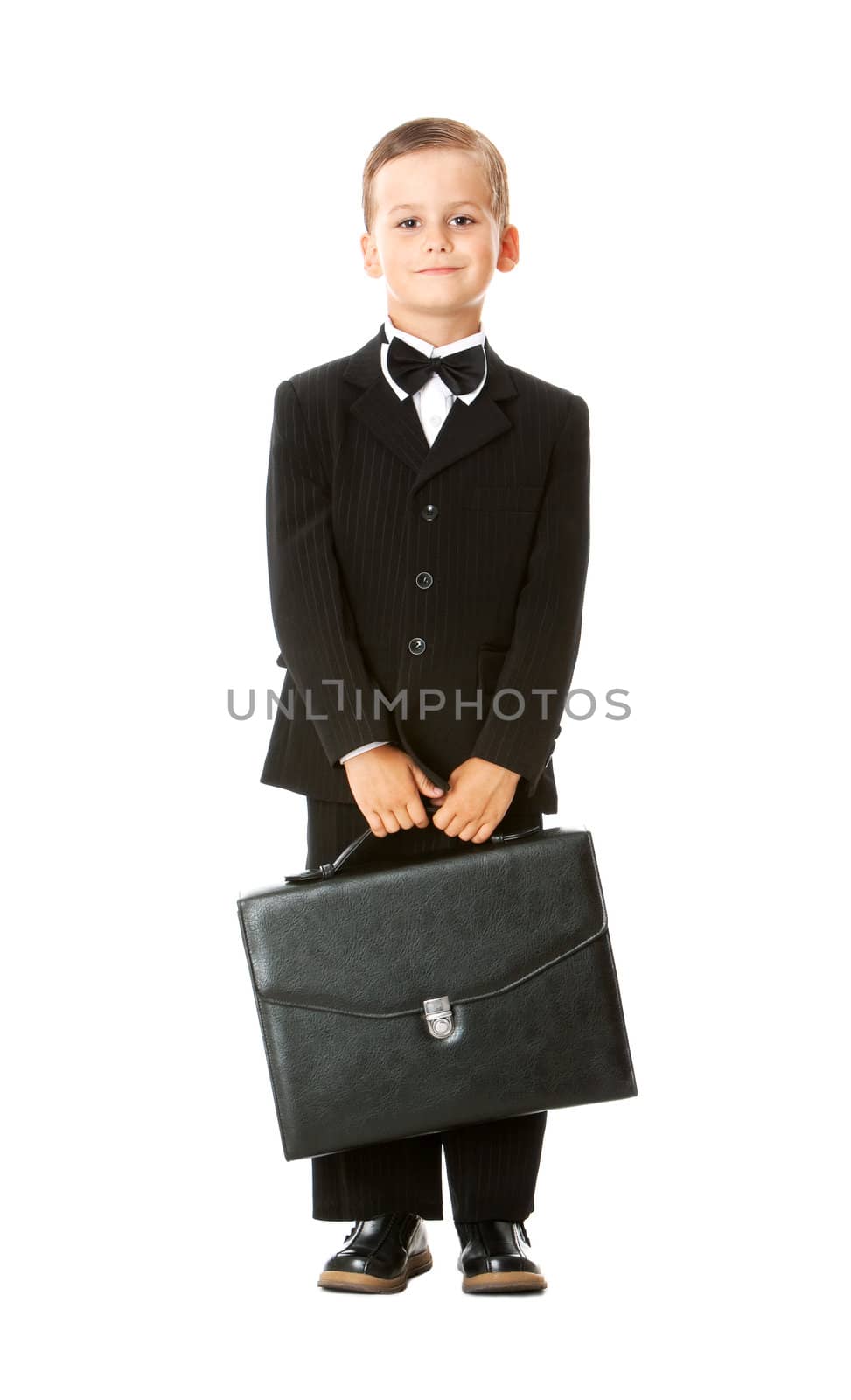 Boy holding a briefcase isolated on white background