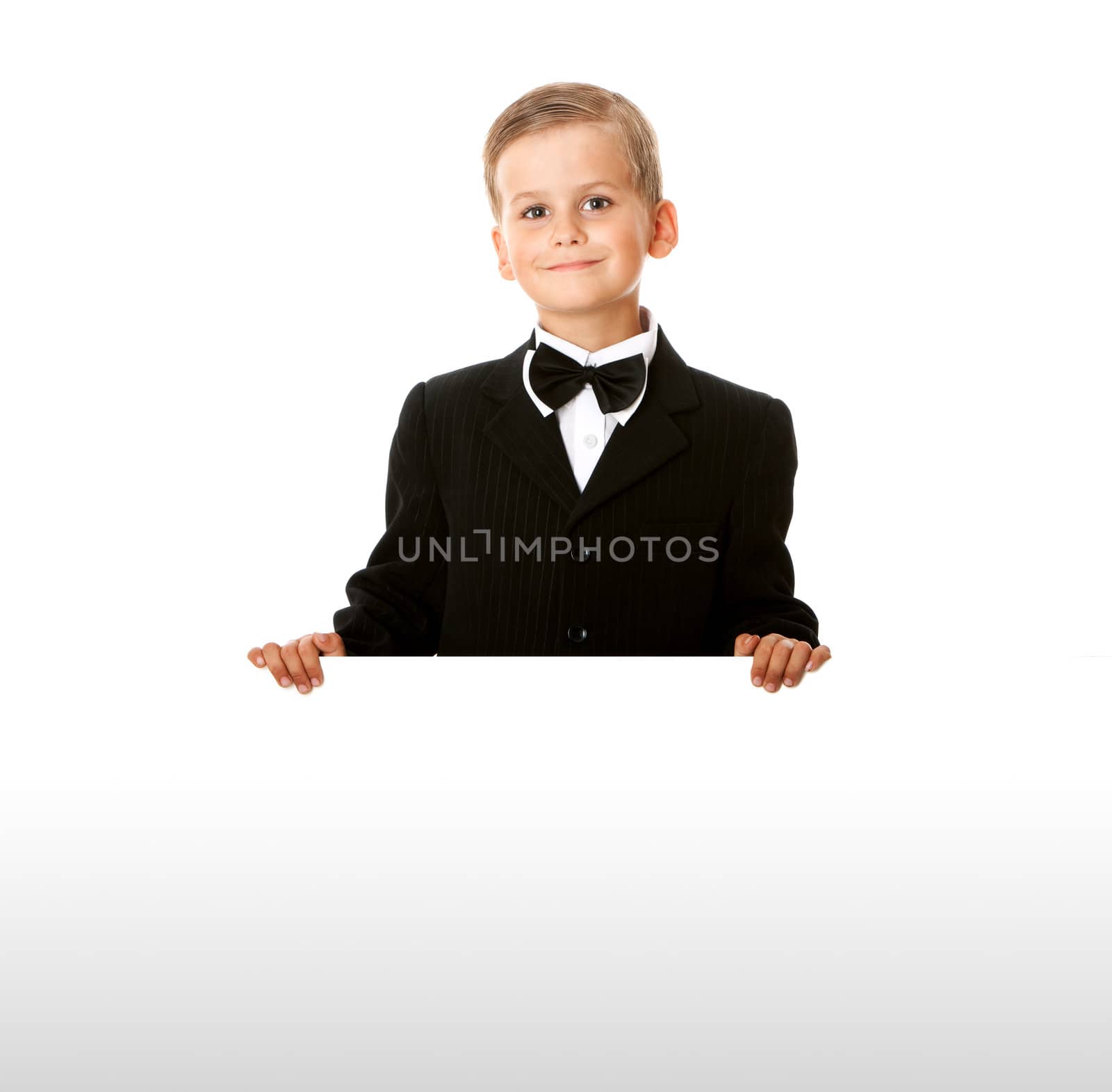 Boy holding a banner isolated on white background