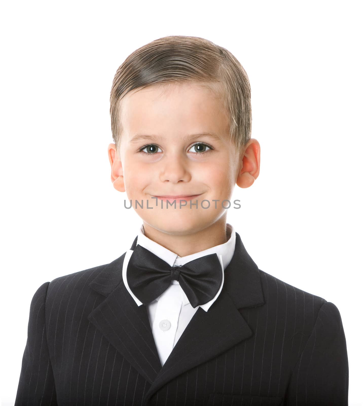 Boy in a suit smiles by bloodua