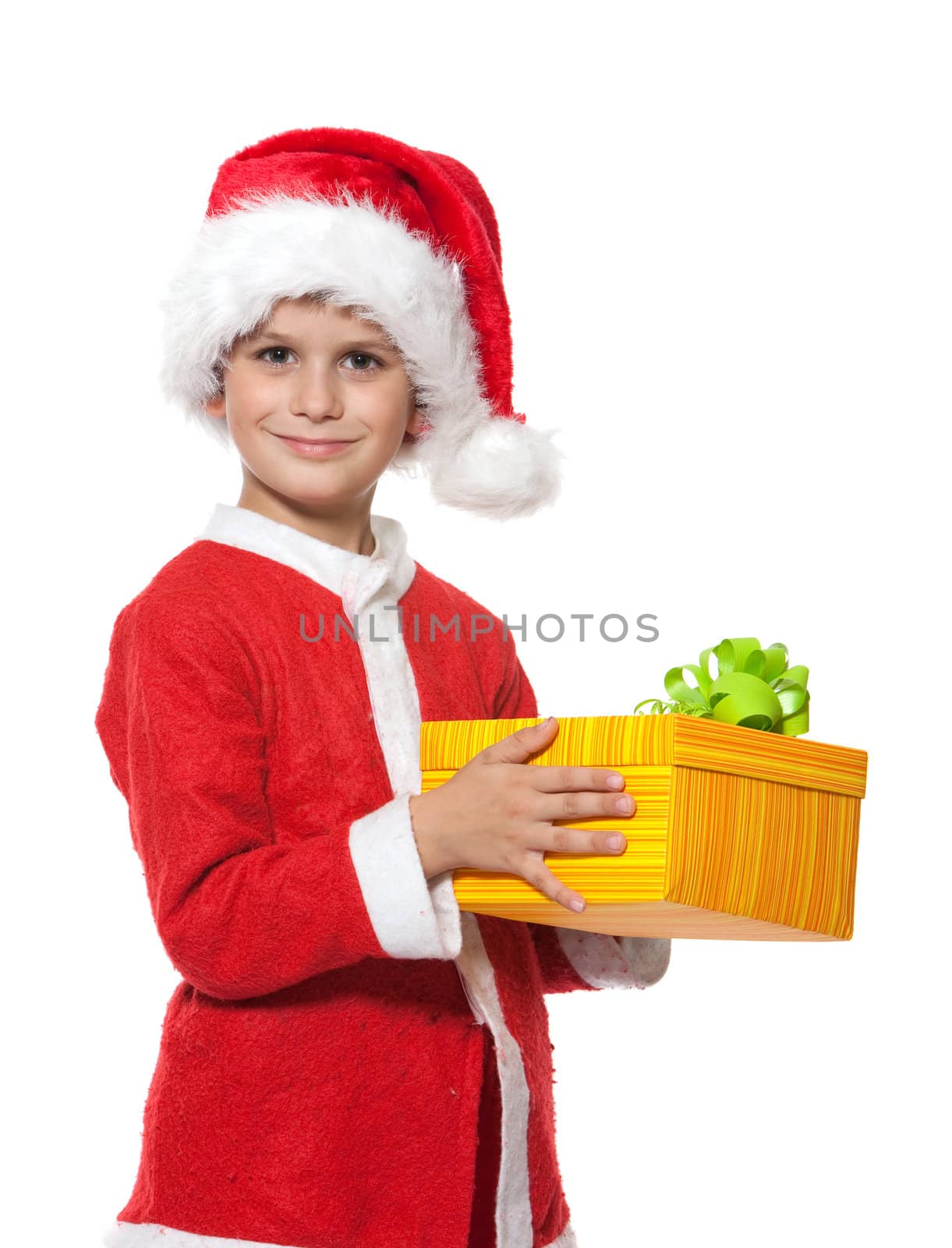 Boy holding a christmas gift isolated on white background