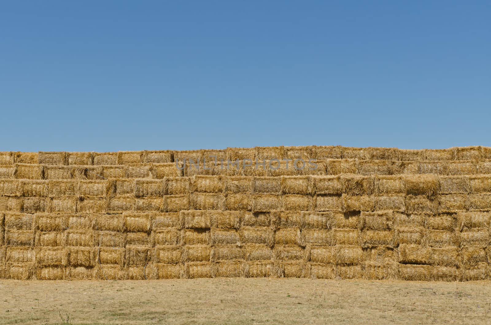 a stack of hay bales, horizontal shot