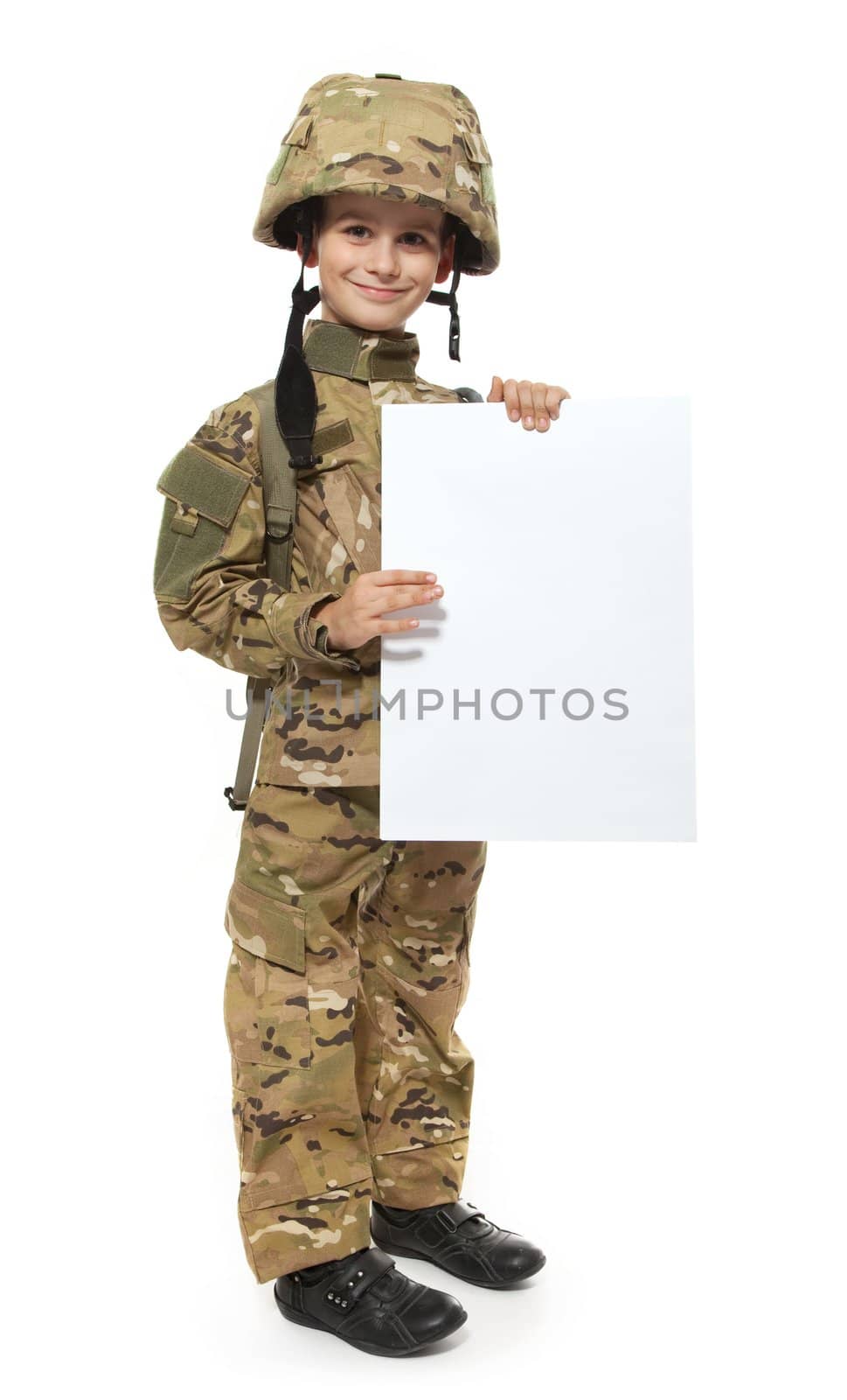 Young Boy Dressed Like a Soldier holding banner isolated on white