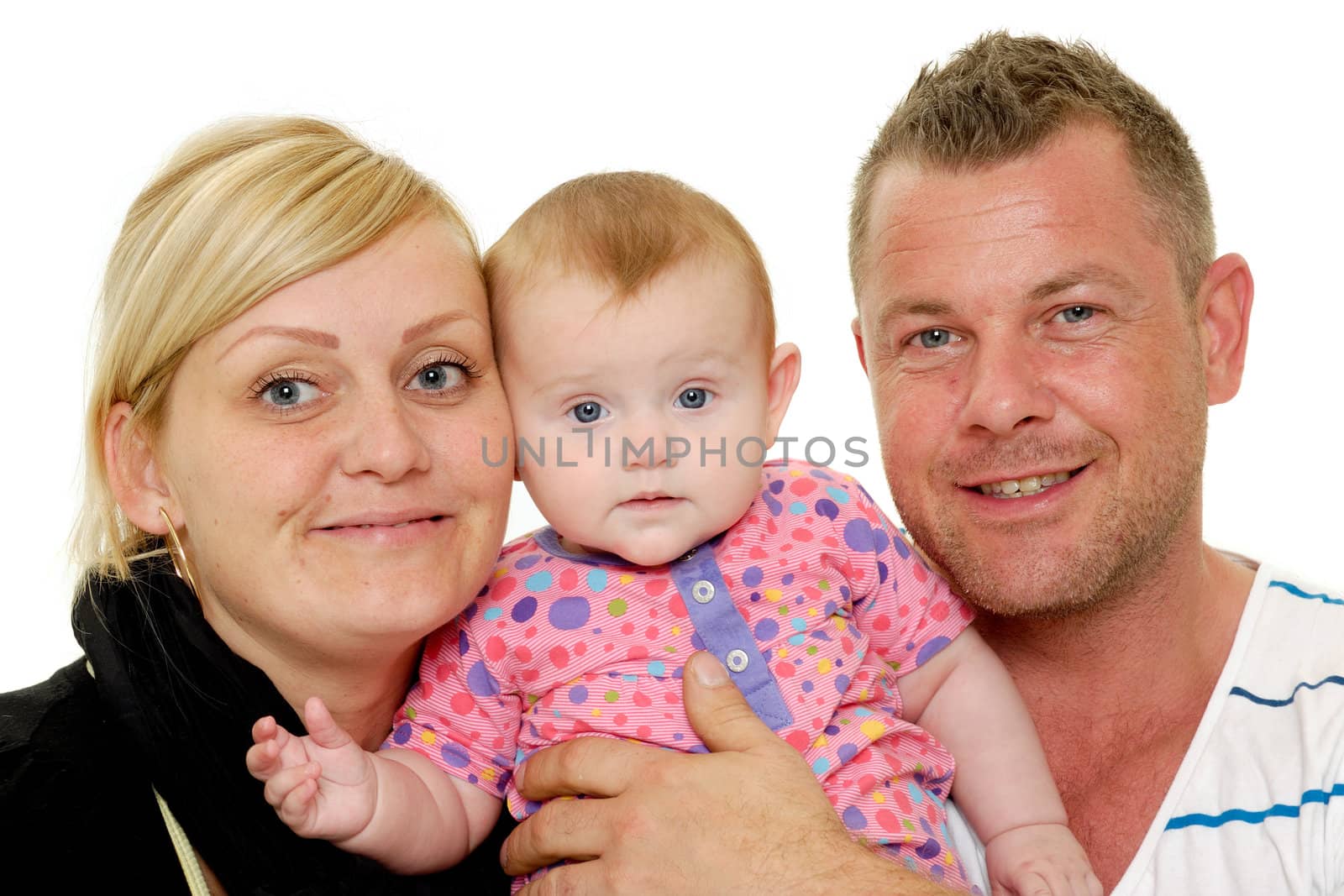 Happy family. Mother and father are looking at their sweet smiling 4 month old baby.