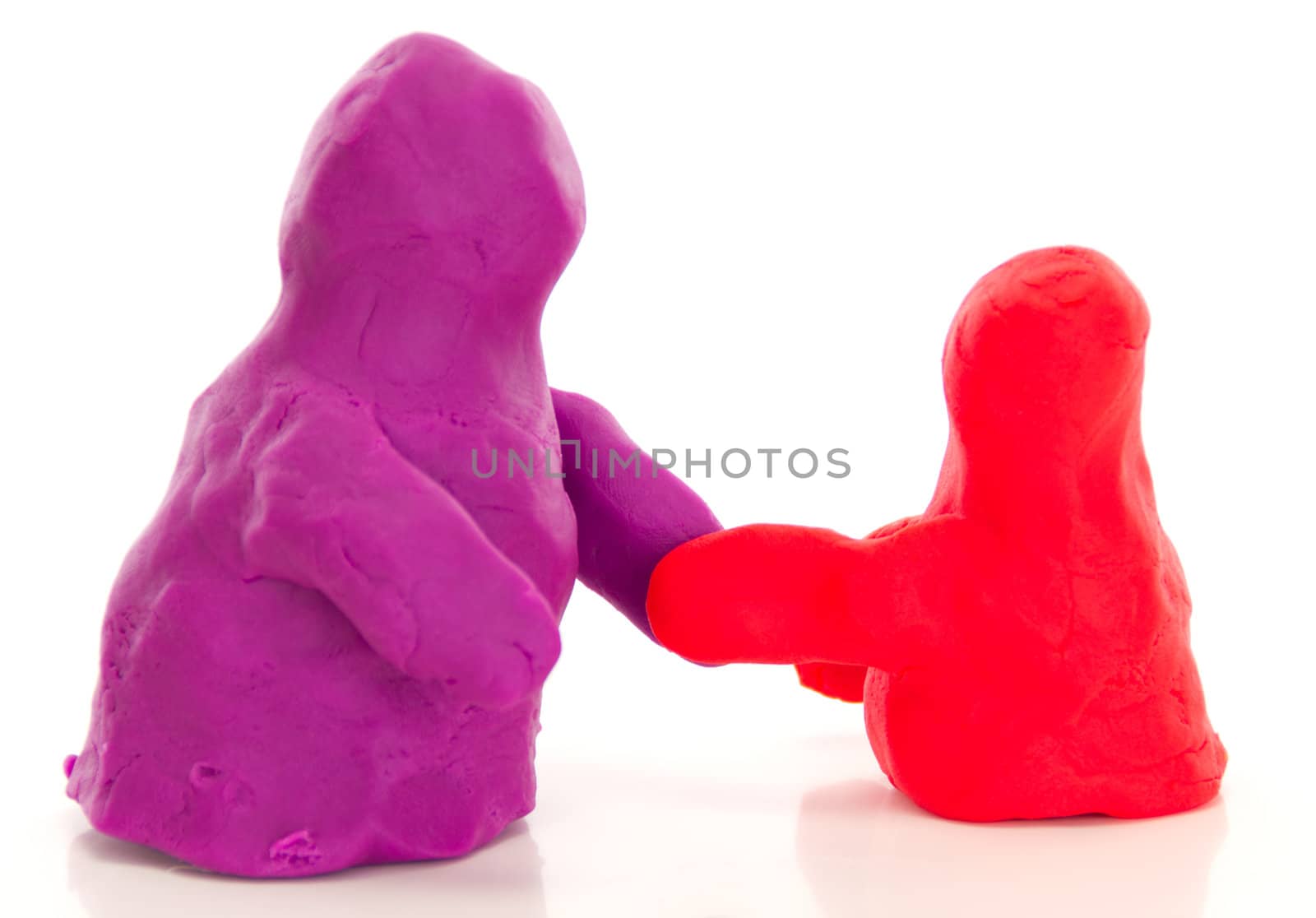 Modelling clay figures handshake