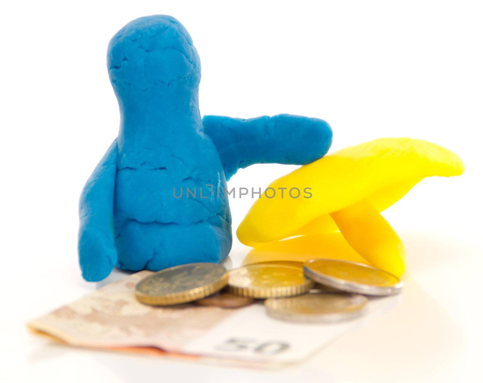 Modelling clay figure with umbrella and money