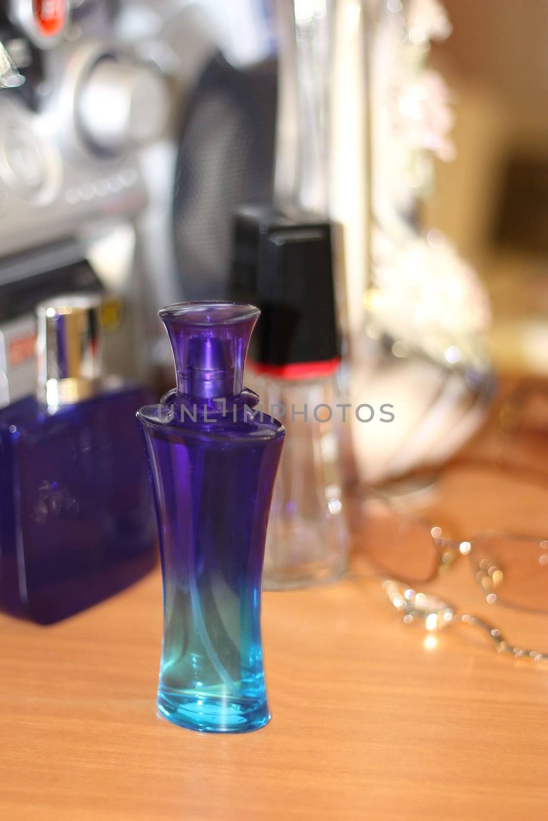 Perfumery on the brown table. Shallow DOF.