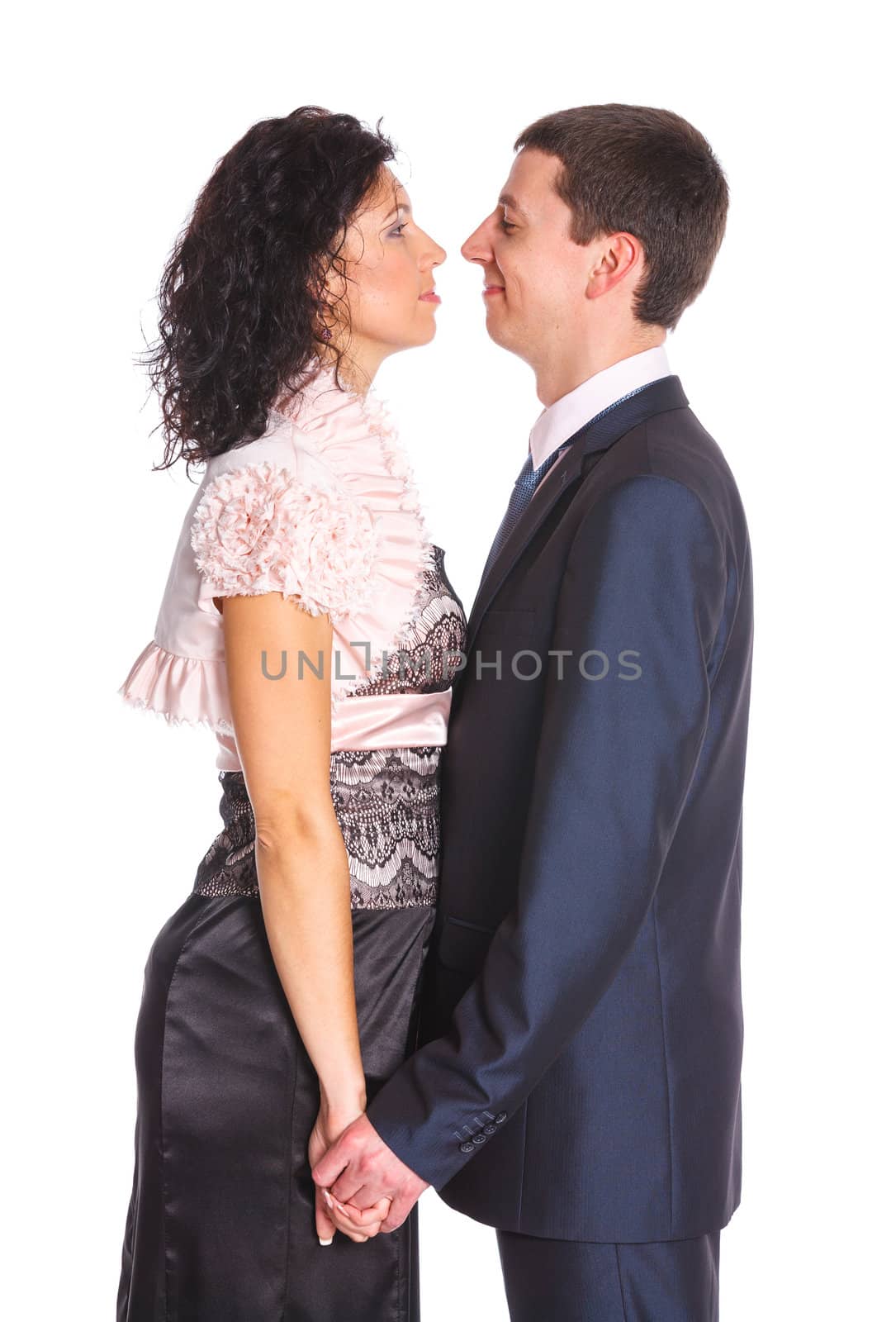 Sweet happy young couple smiling together. Isolated on white background