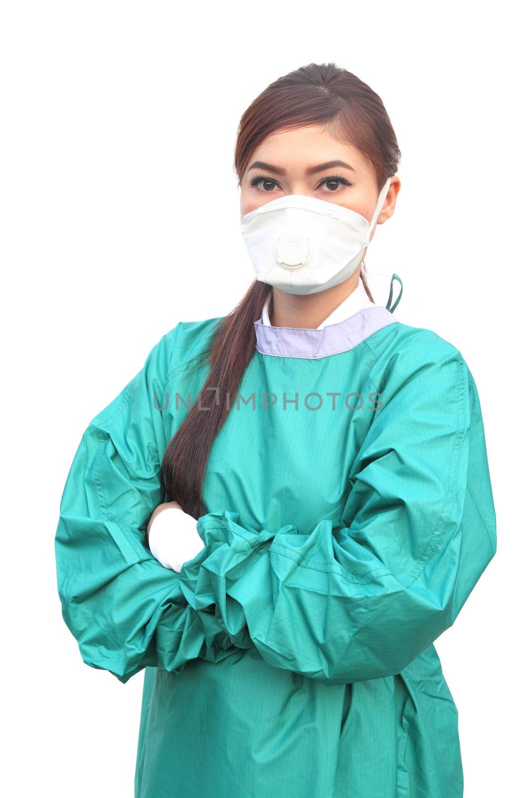female doctor wearing a green scrubs with mask