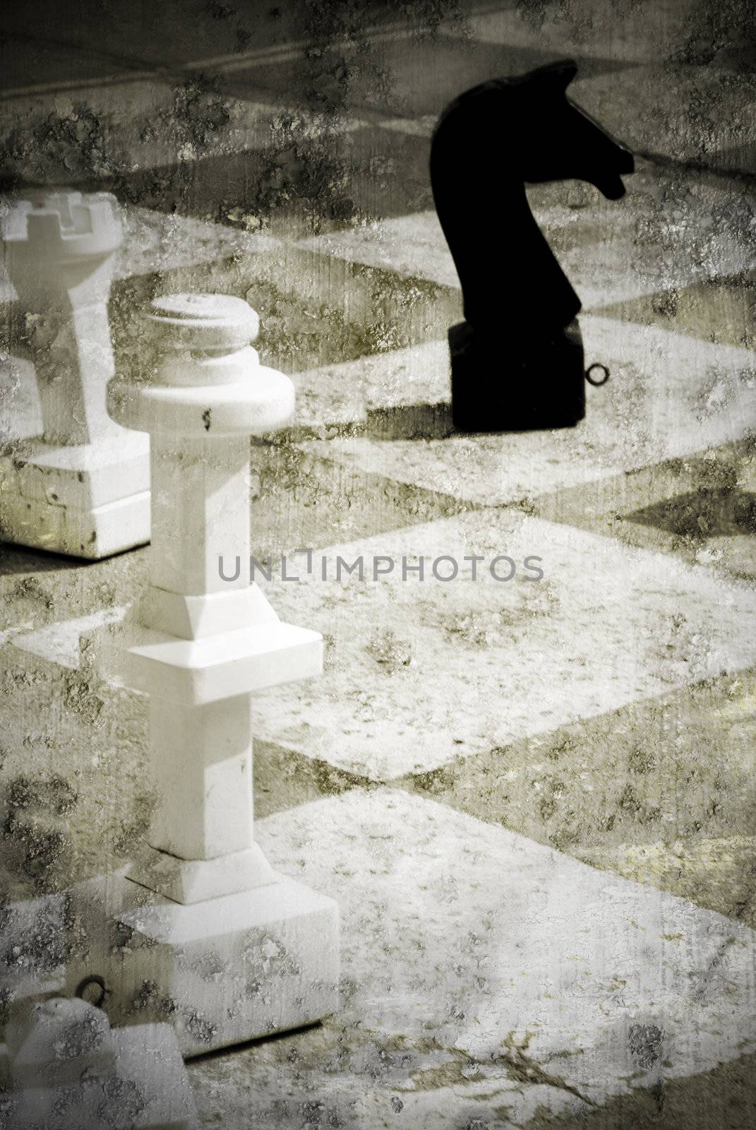 Grungy chessboard with a white king and a black horse with a strong grungy touch