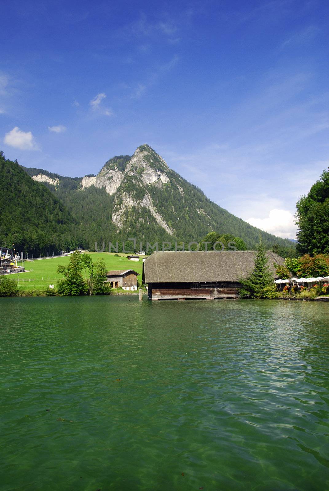 Famous lake Konikssee and a view at harbor and Alps peaks 