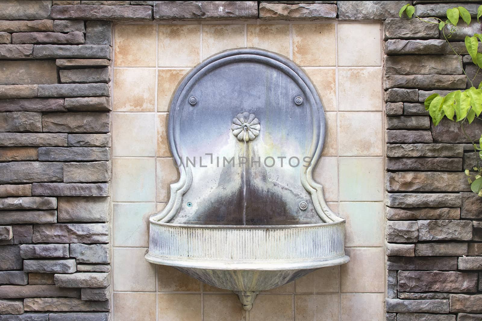 Tuscan Style Wall Water Fountain on Formal Courtyard Garden Horizontal