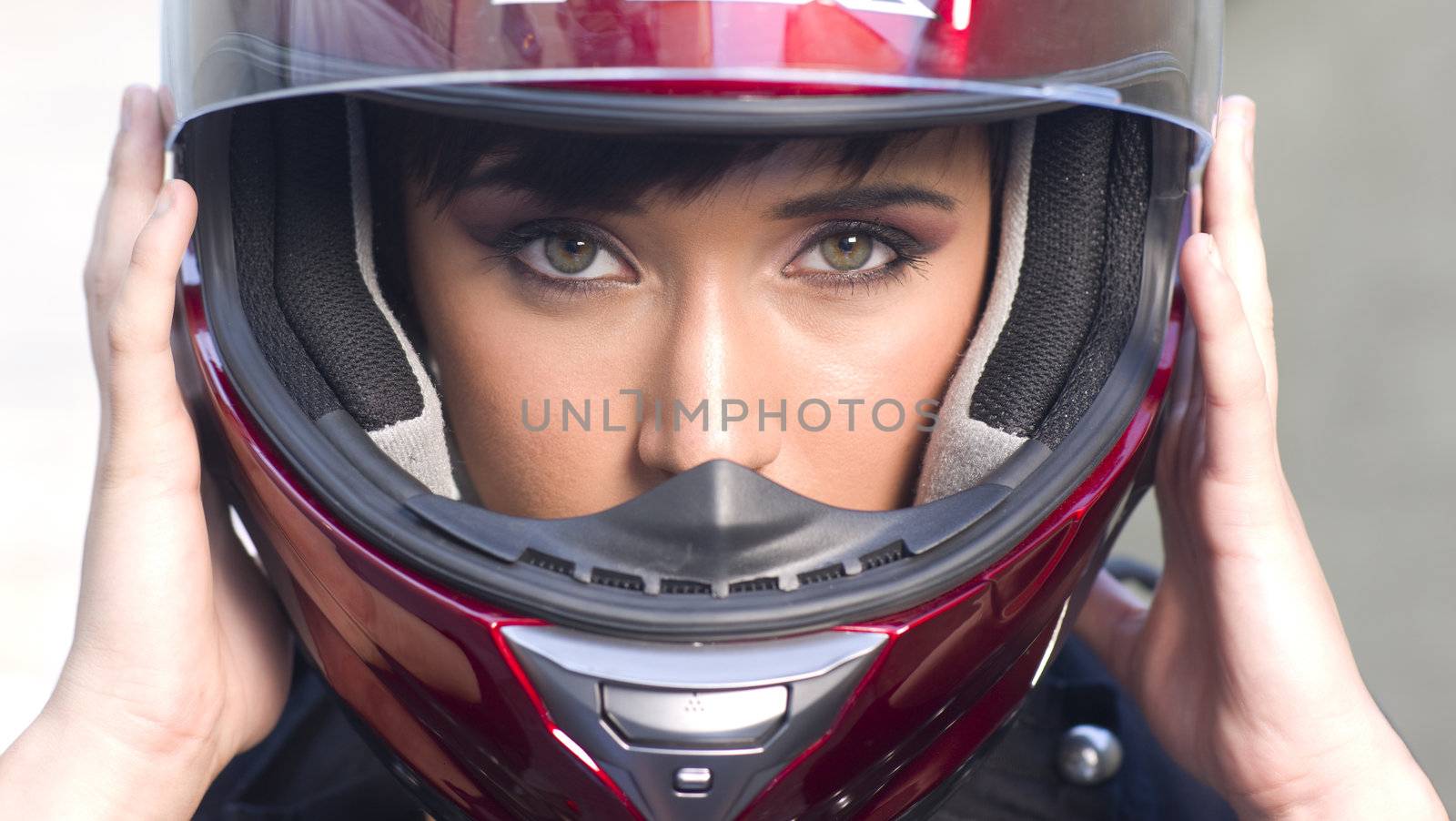 Girl puts on Helmet