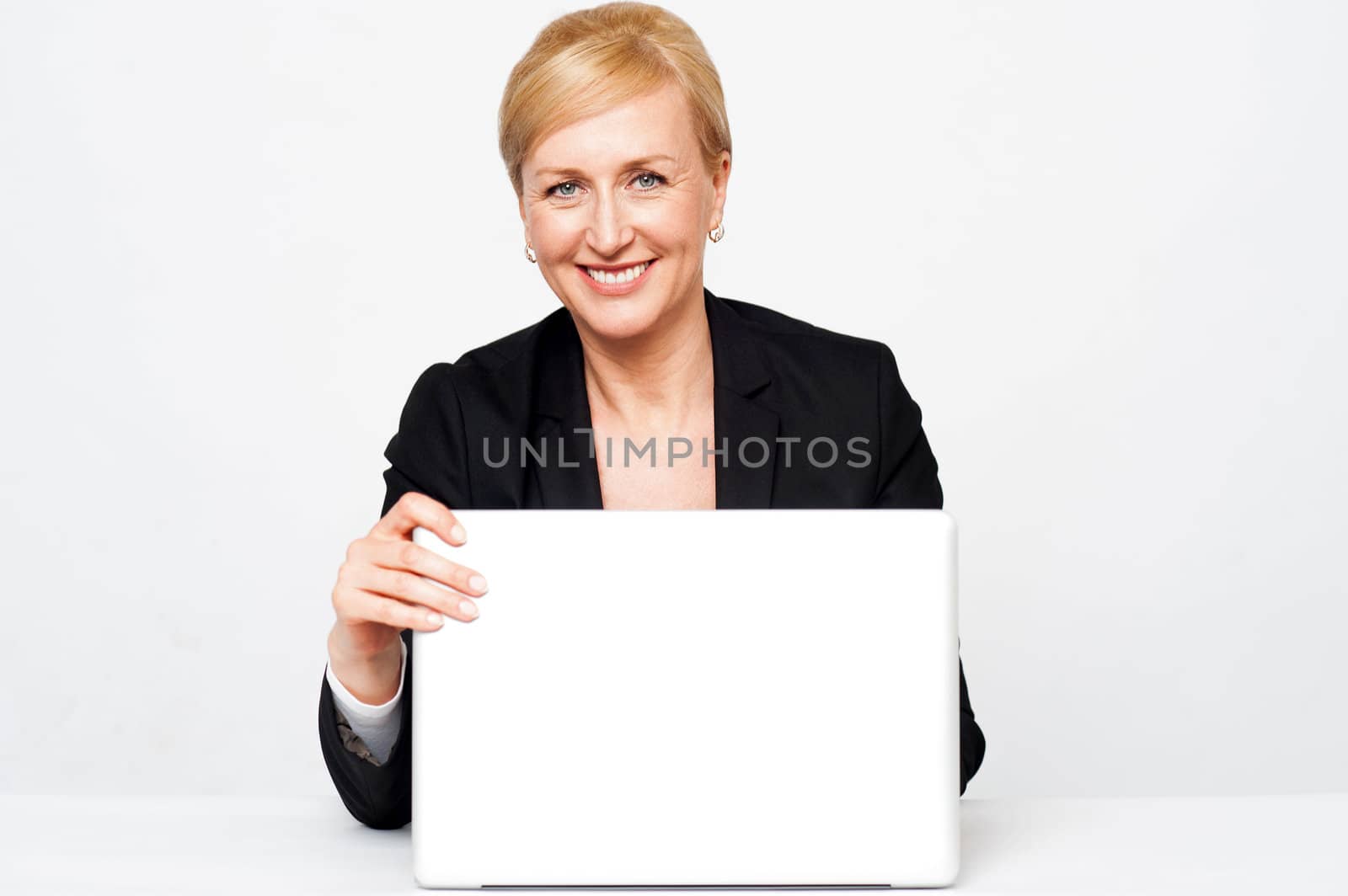 Secretary holding laptop flap, about to close. Isolated on white background