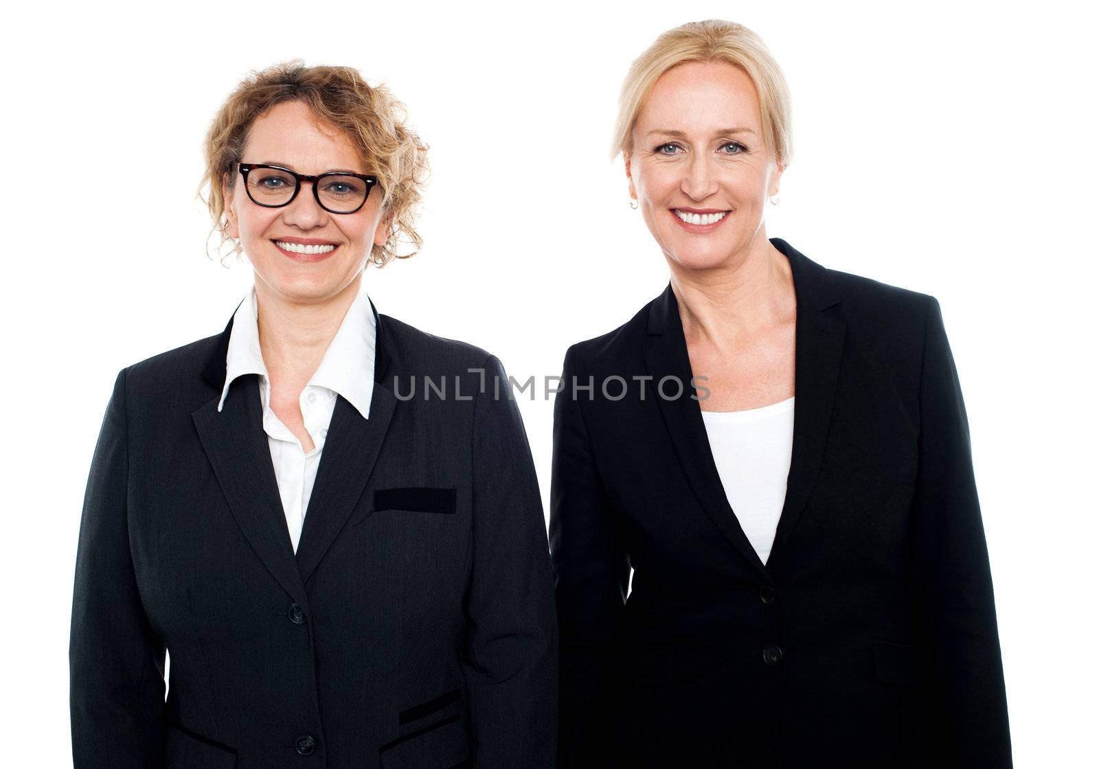 Team of two smiling businesswomen posing isolated on white background