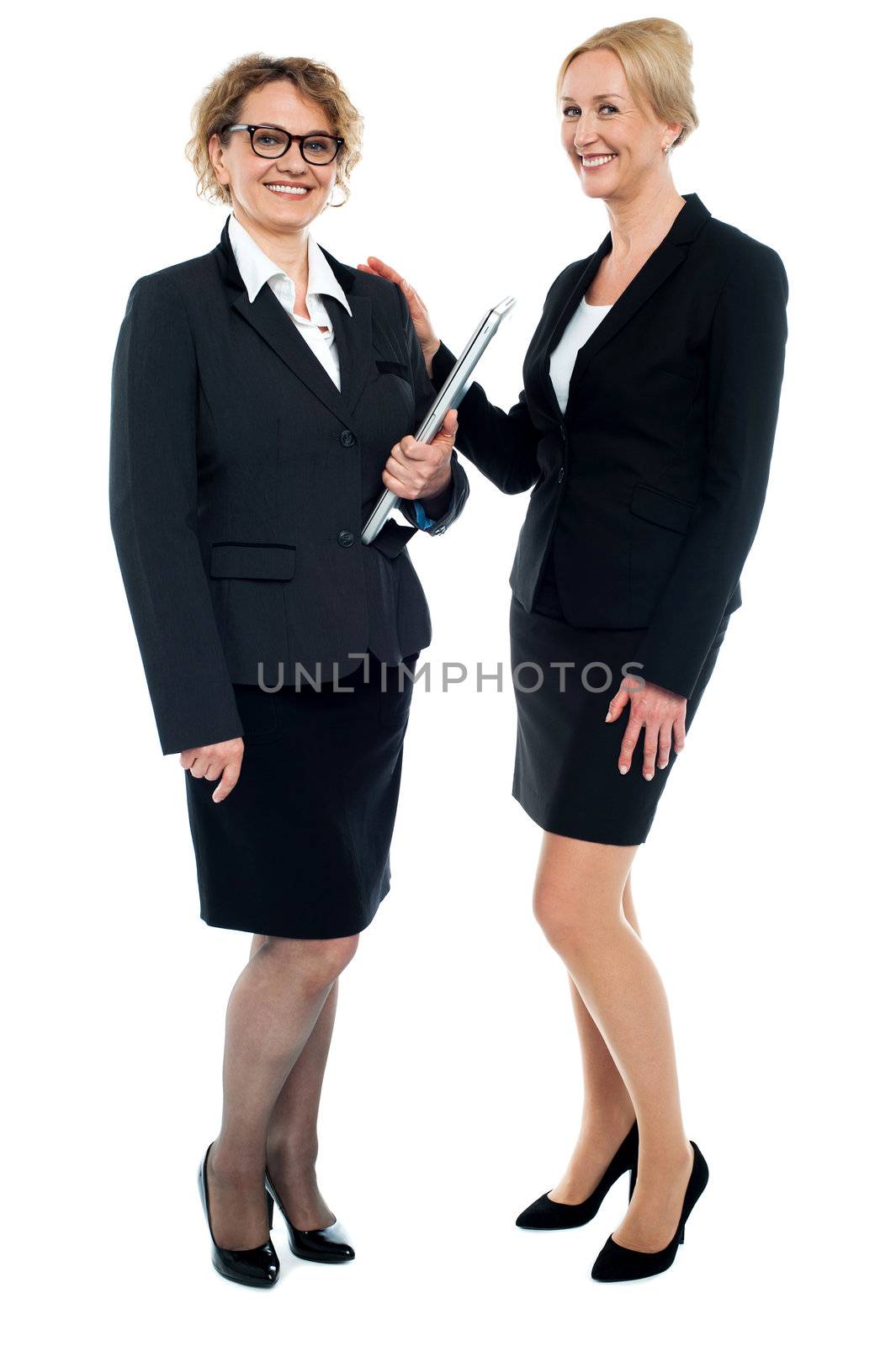 Full length shot of corporate female friends isolated against white background